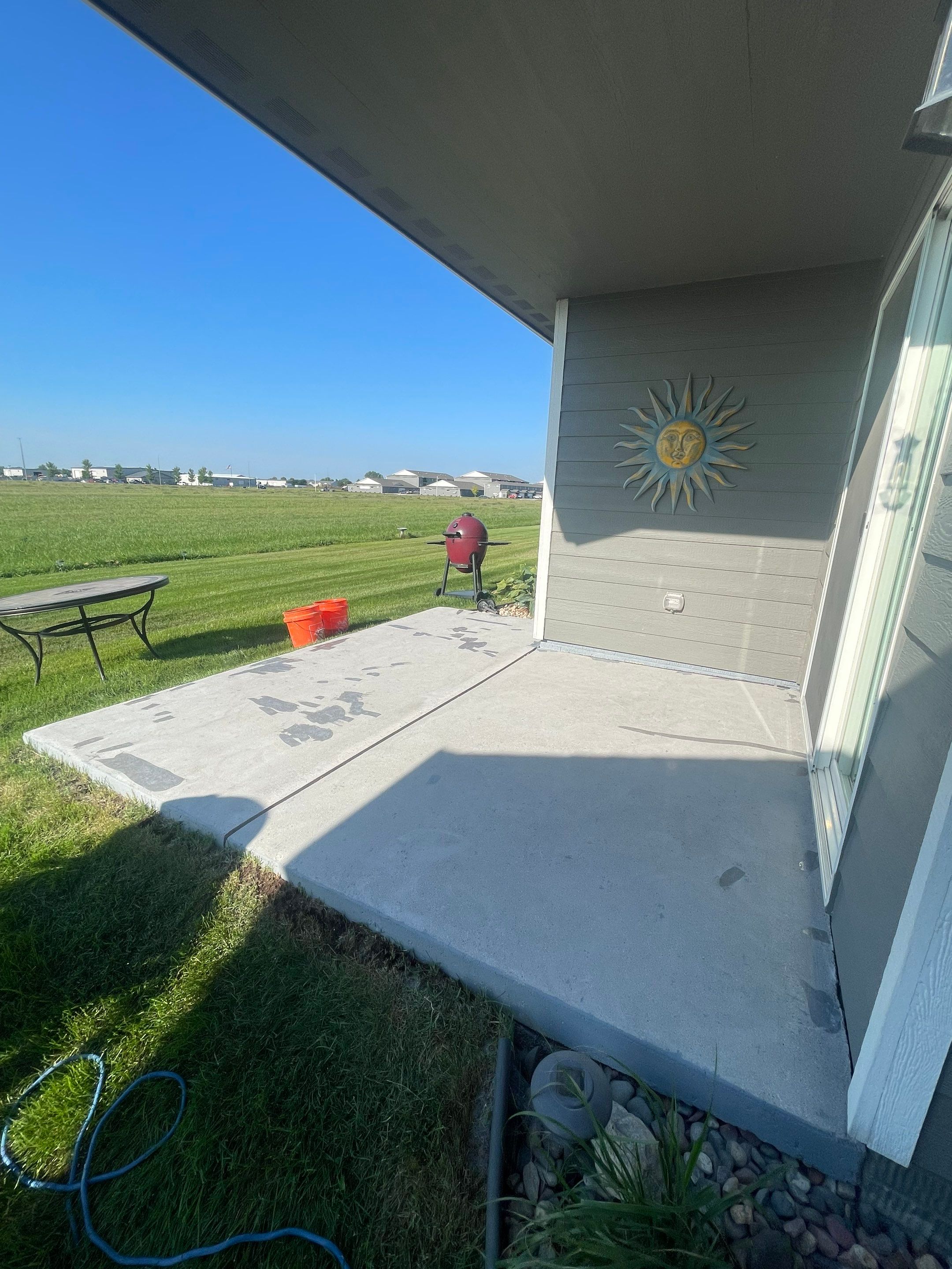 Starry Evening Concrete Patio Coating Installation in Tea by Select Painting, Coatings & Garage Cabinets