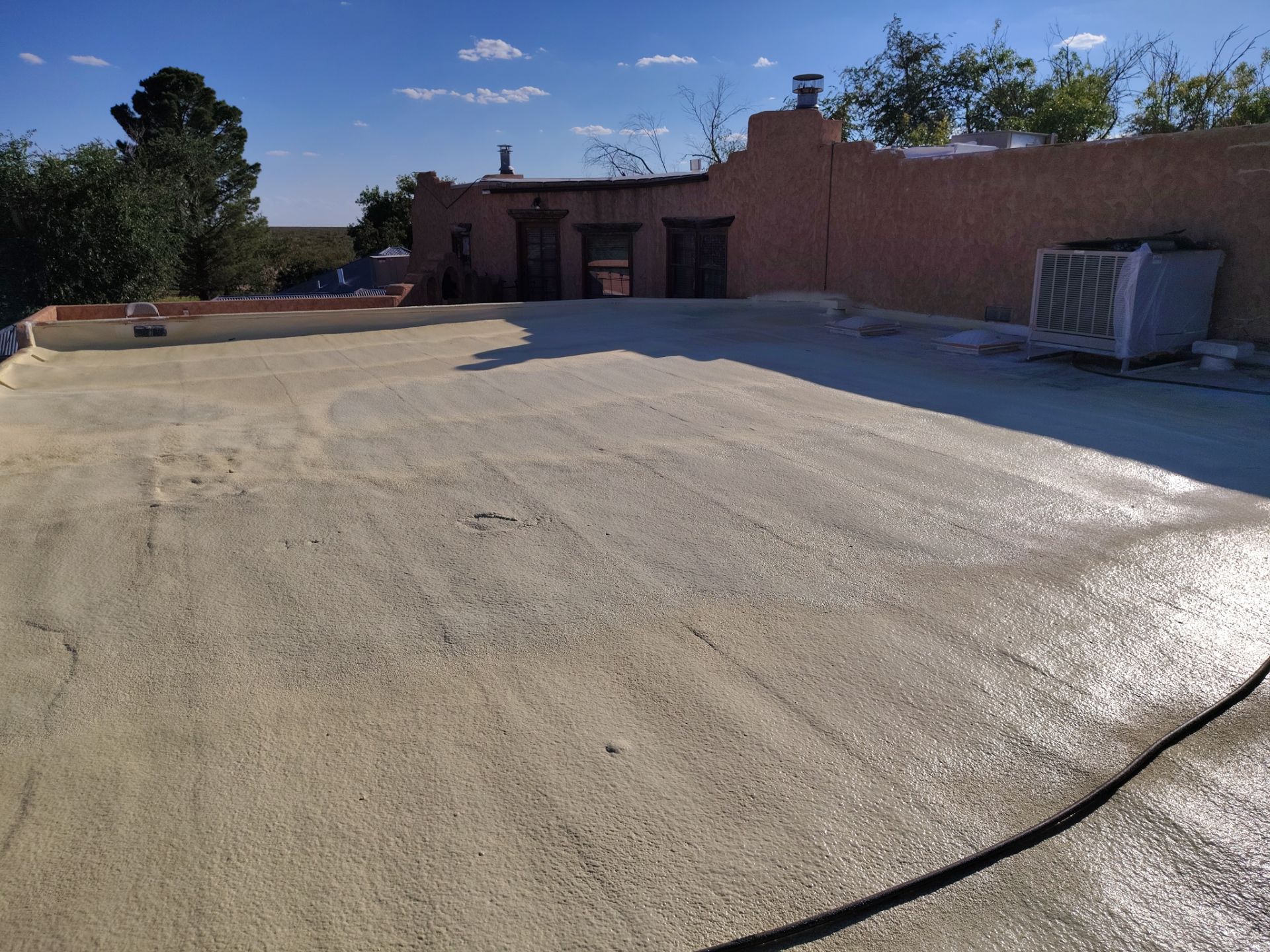 Residential roof application by SPF Services 