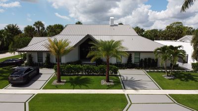 Residential Roofing Installation using 1" Nail strip metal roof