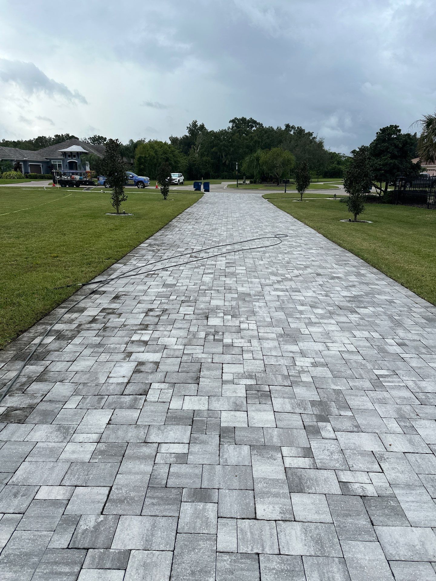 Complete Two-Story House Wash and Driveway Cleaning in Winding River Community, Bradenton, FL by Sunshine AquaWash