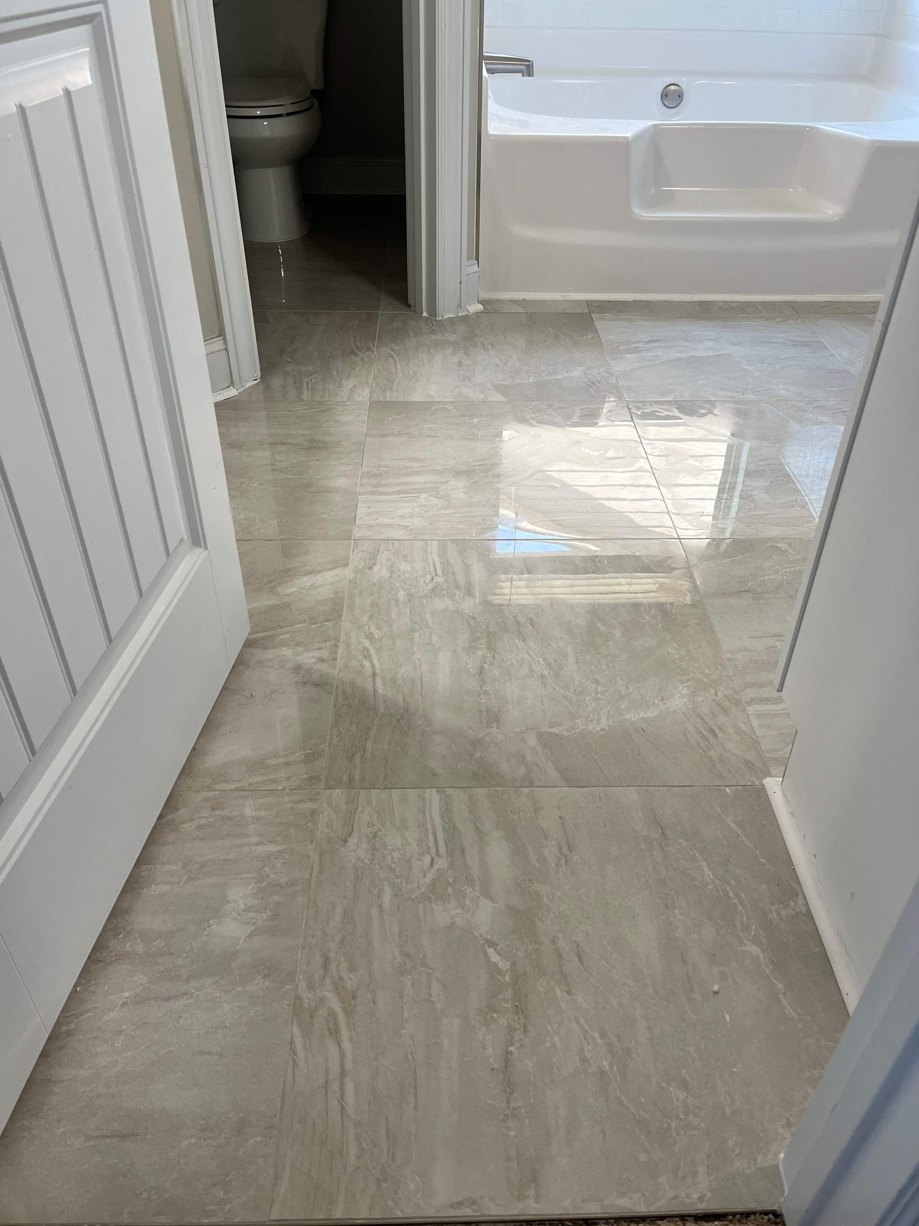 Shower retile and bathroom flooring by Prudencio