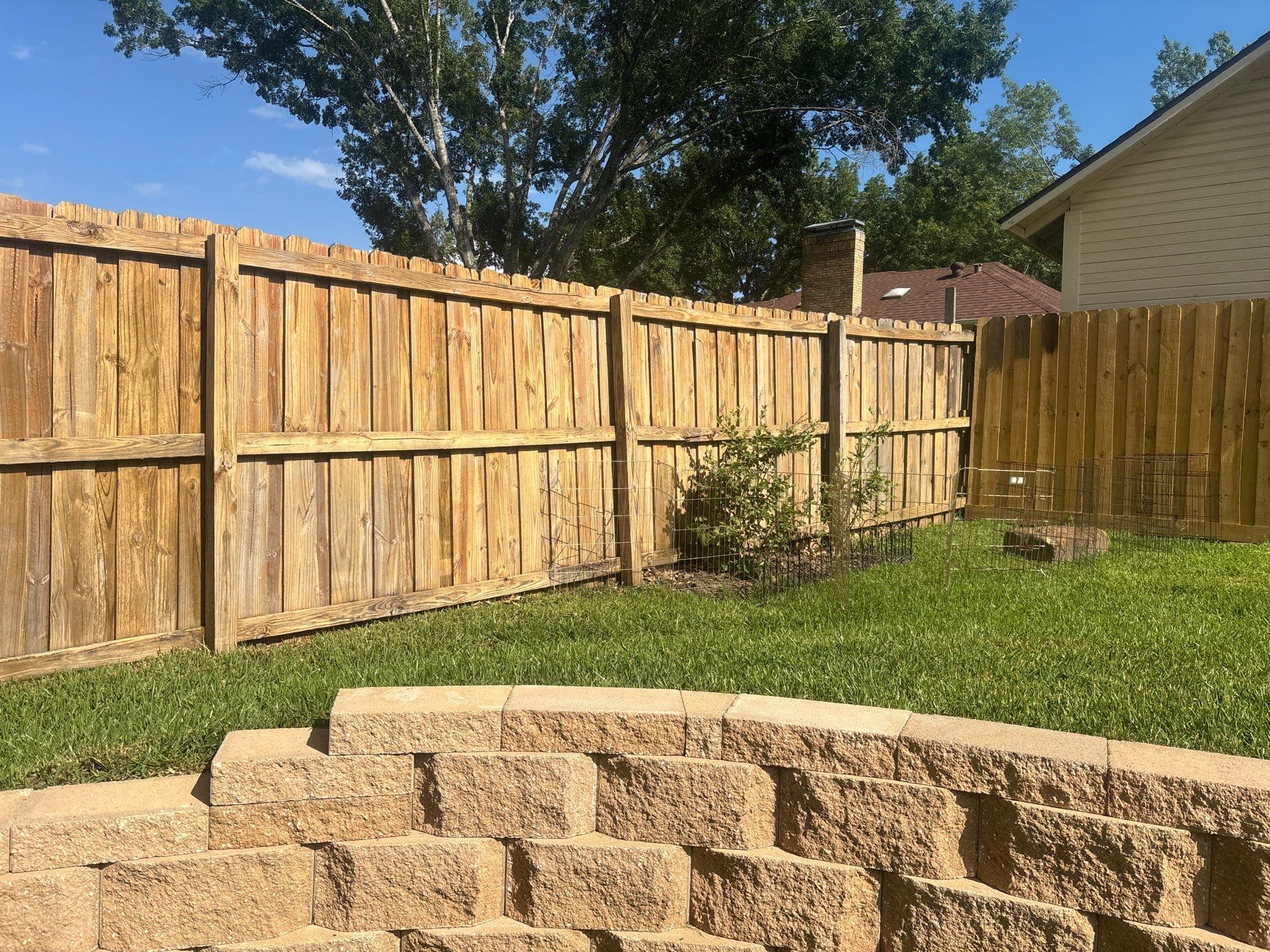 Project in TylerExterior Painting in Tyler, TX | White Brick Home, Varnished Fence & Shed Painting by Quality Coats Painting