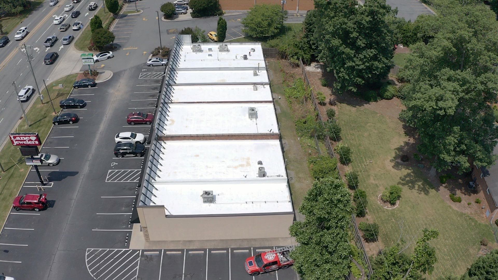 Commercial Roof Coating using Fiberseal basecoat and Silicon Topcoat by Just In Time Roofing and Restoration