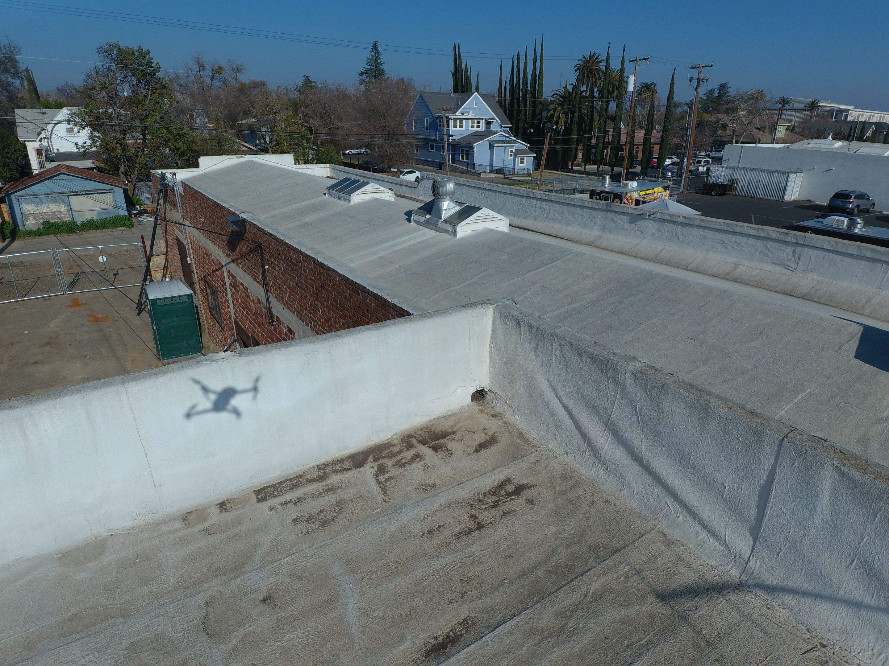 Commercial Roofing Installation using Conklin BenchPly system with PUMA top coat (imbedded fabric system) by Straight Edge Roofing Inc