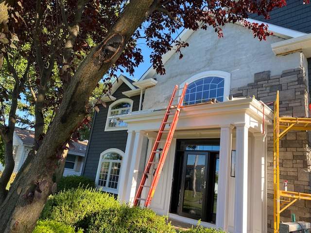Exterior Renovations- Siding, Concrete, Railings, and Entry Door  by Ivy Lea Construction