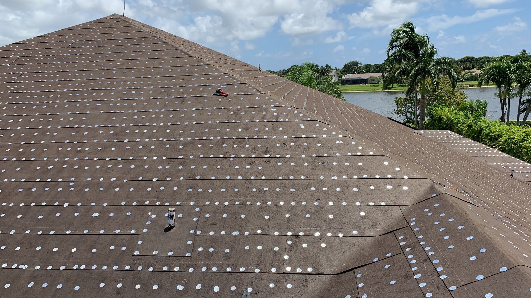 Residential Roofing Installation using 1" Nail strip metal roof by BLUES BROTHERS ROOFING
