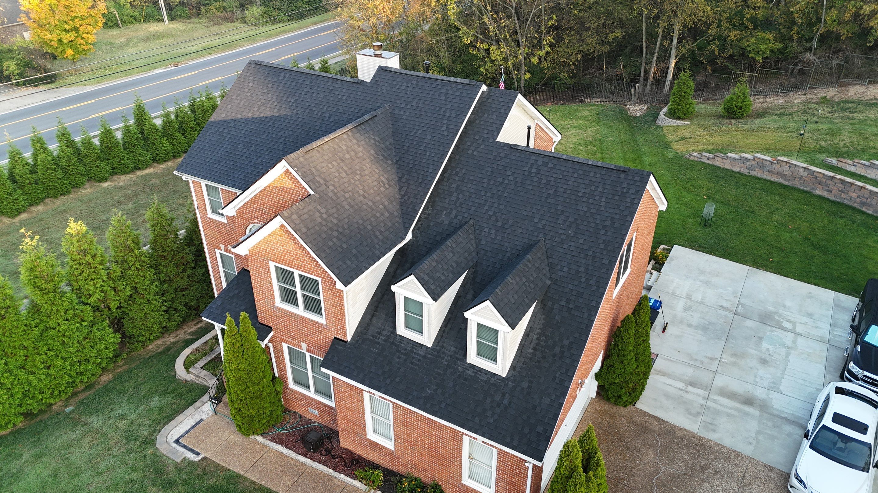 Charcoal Black Re-Roof & Gutters by Royal House LLC
