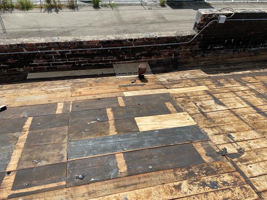 Commercial Roofing Installation using Conklin BenchPly system with PUMA top coat (imbedded fabric system) by Straight Edge Roofing Inc