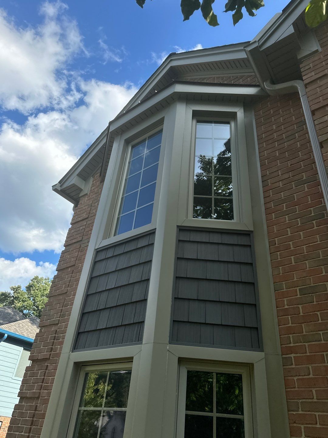 Roof Replacement using Owens Corning Peppercorn and Siding Replacement using Ascend Charcoal Smoke by 180 Contractors