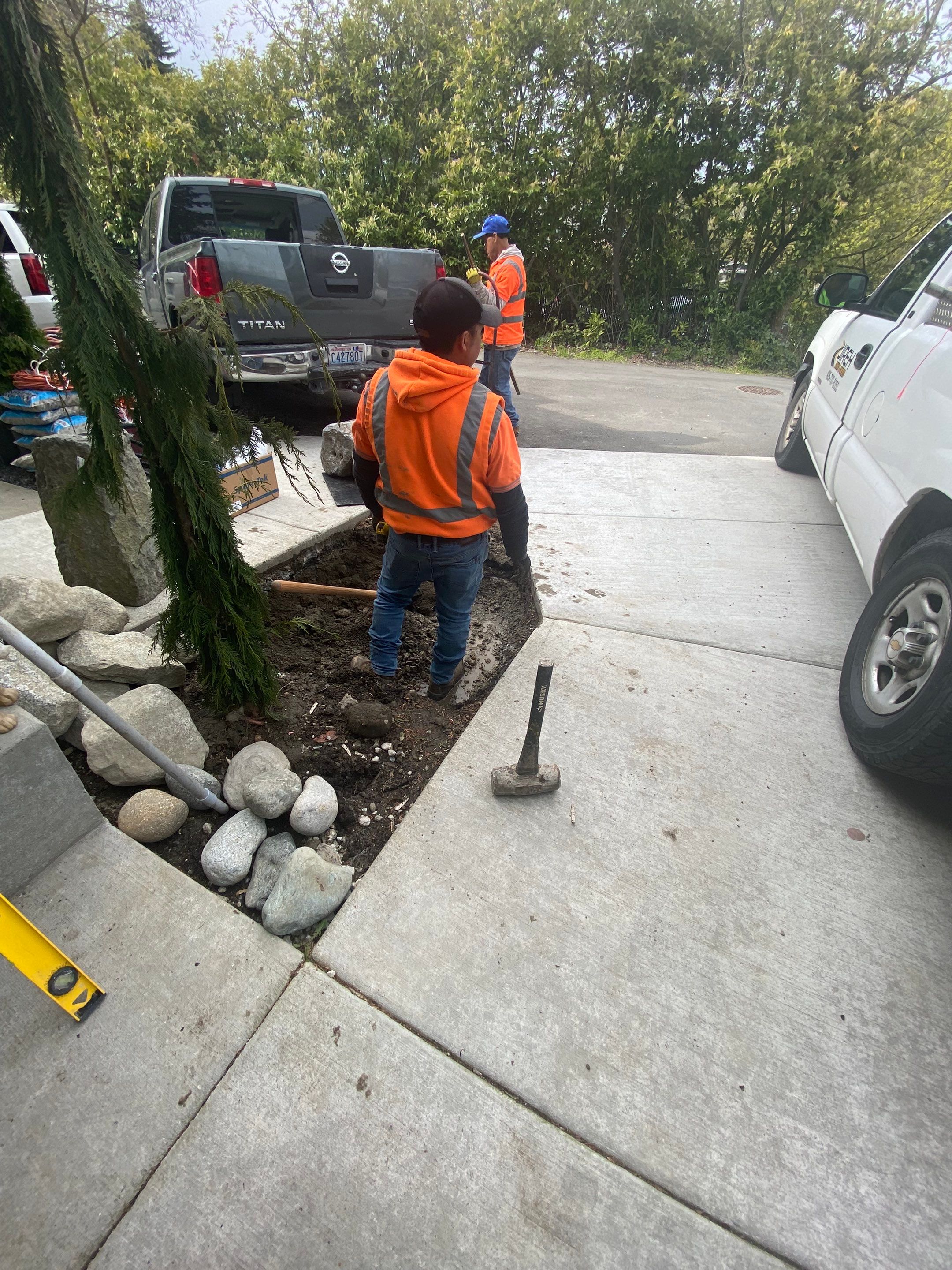 Patio Installation using Concrete, Retaining walls, and Turf install by Jireh Asphalt & Concrete Inc 