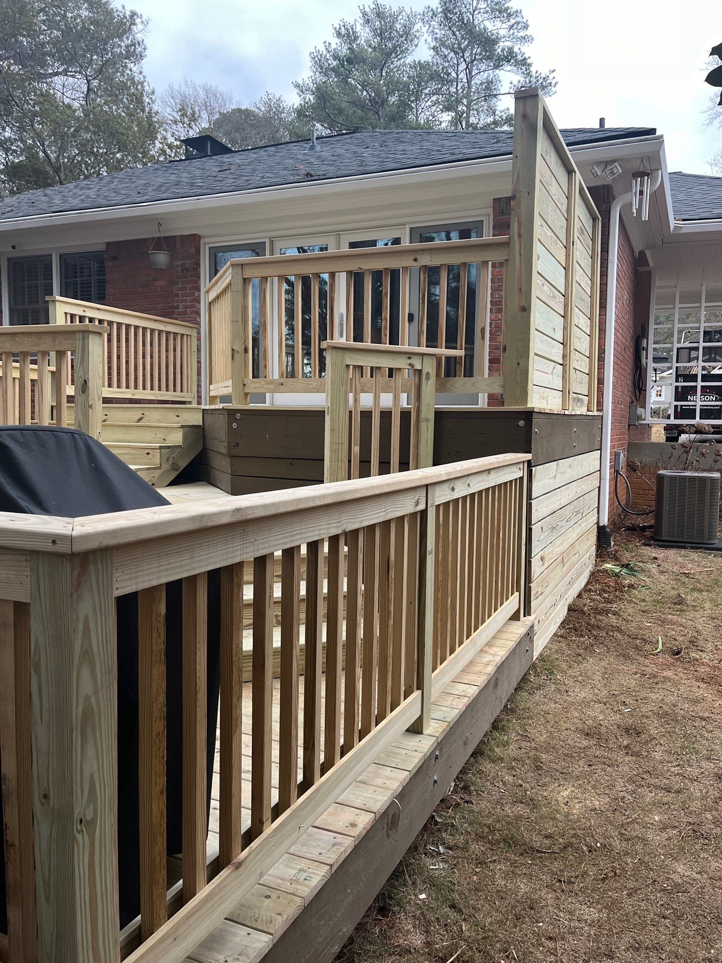 Wood Deck Resurface with Privacy Wall in Buckhead, GA by Nelson Exteriors