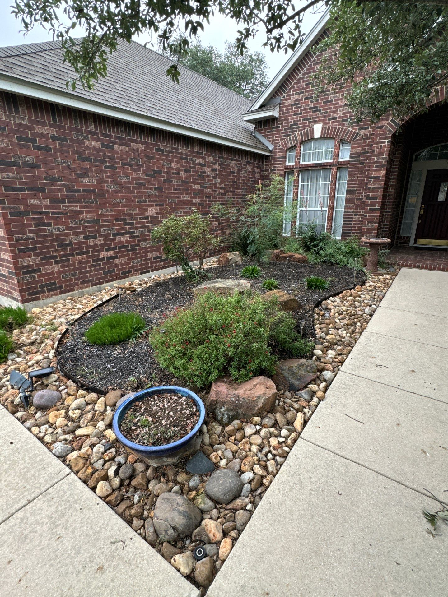 Landscaping Enhancement  using Texas Black Gravel by Hole In One Lawns, LLC