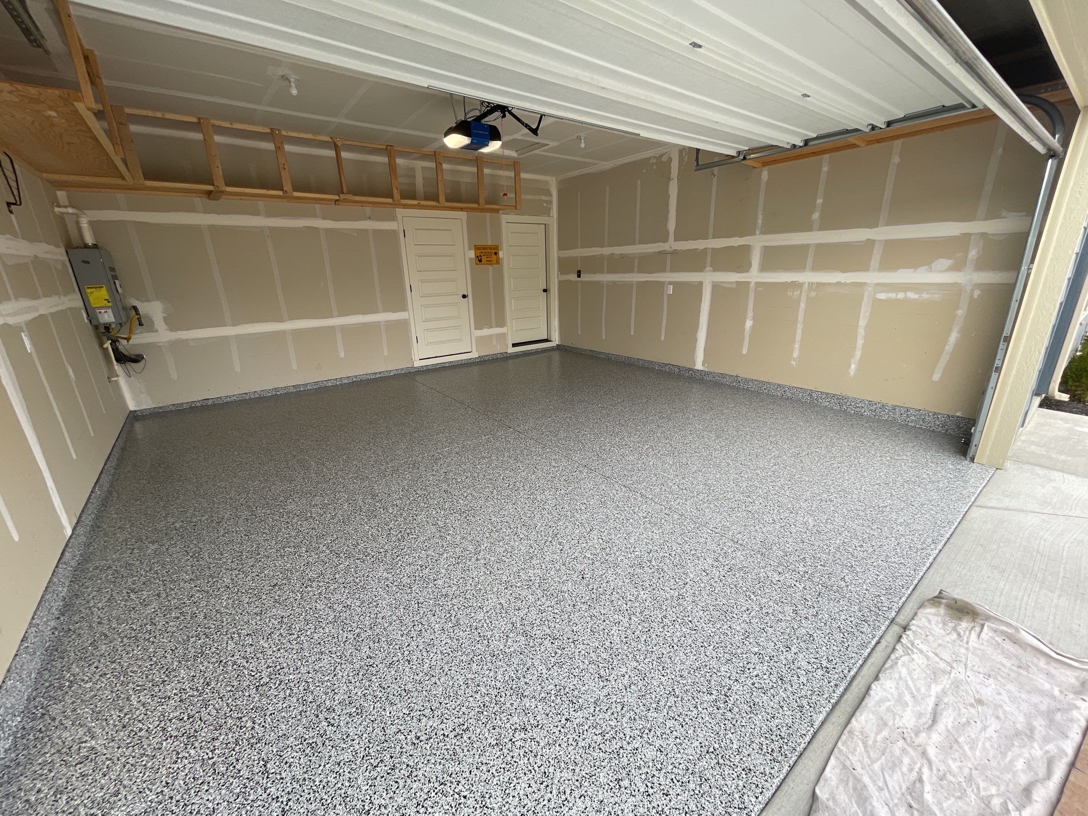 Garage Transformation using Domino by Croc Coatings, LLC