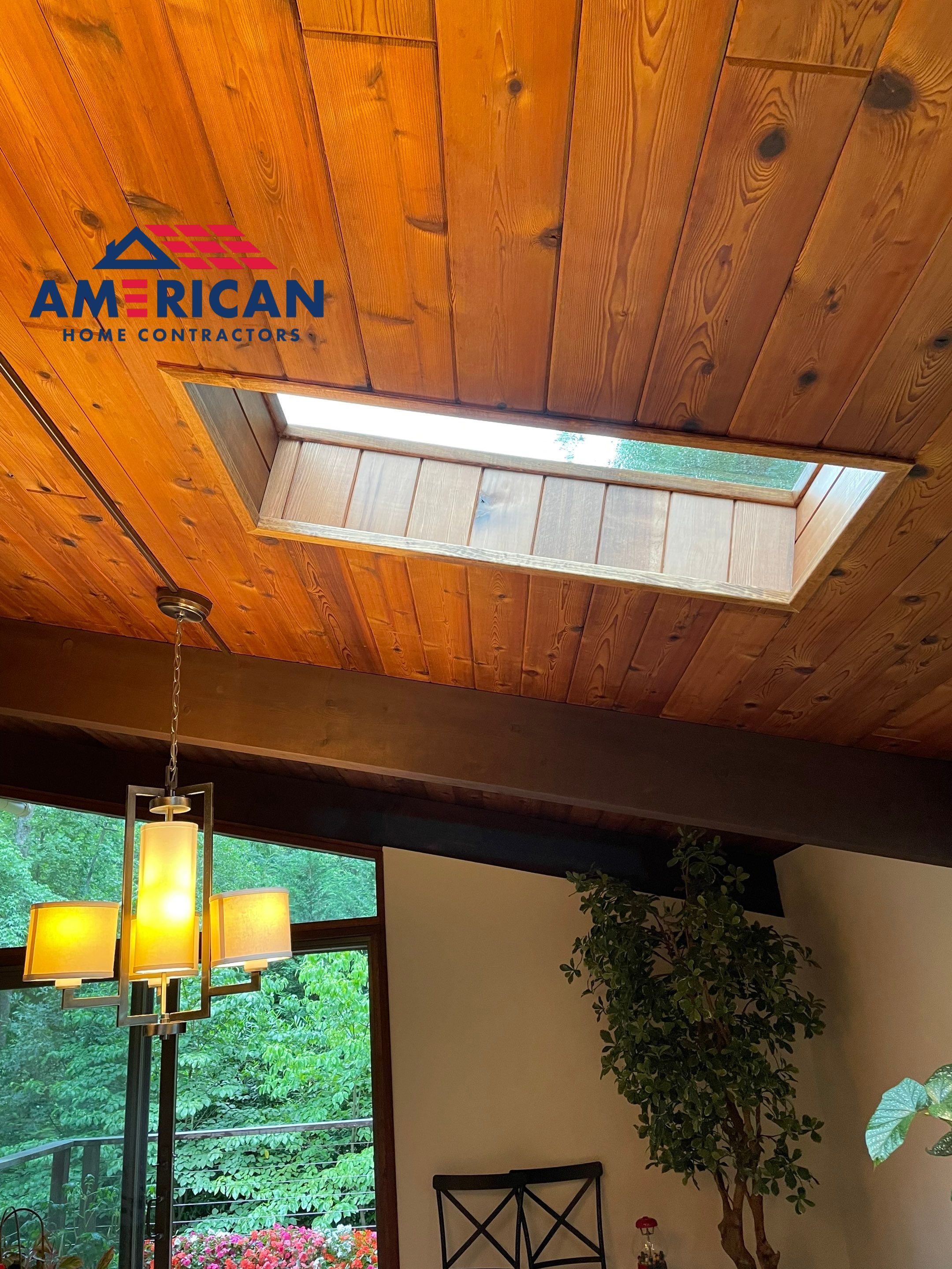 Acorn Deck House Roof Replacement + Skylight Addition by American Home Contractors