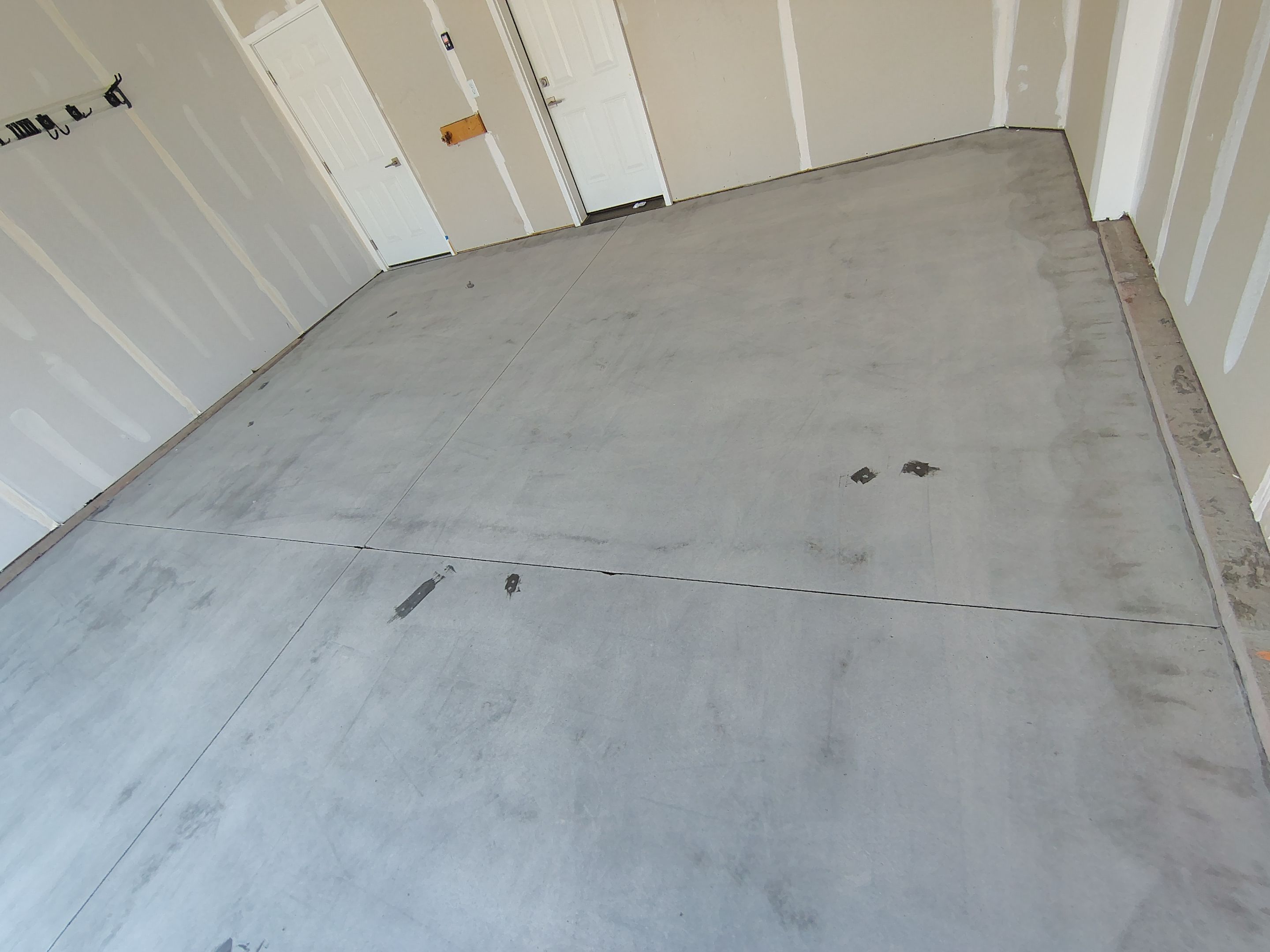 Custom Epoxy Garage Floor and Patio Coating in Sioux Falls by Select Painting, Coatings & Garage Cabinets