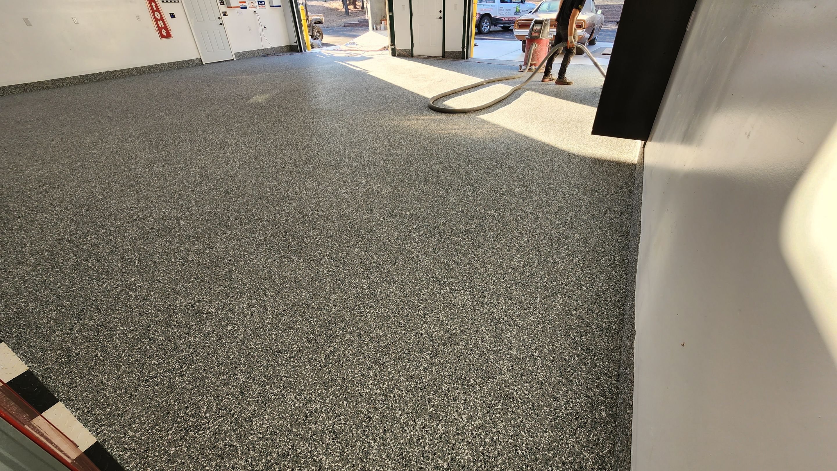 Garage Transformation using Domino with Blue by Croc Coatings, LLC