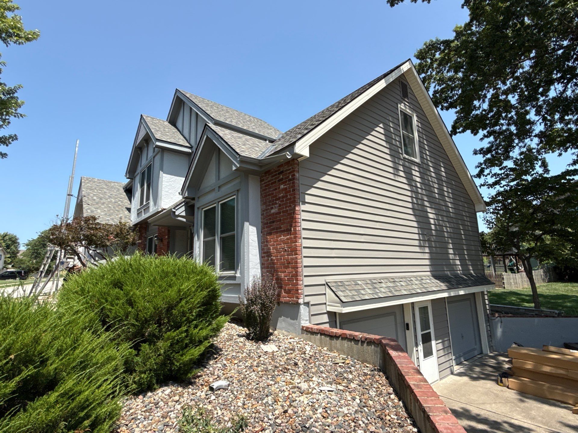 Whole Home Siding Replacement and Gutter Installation in Gladstone by EEC  Windows, Siding & Roofing 