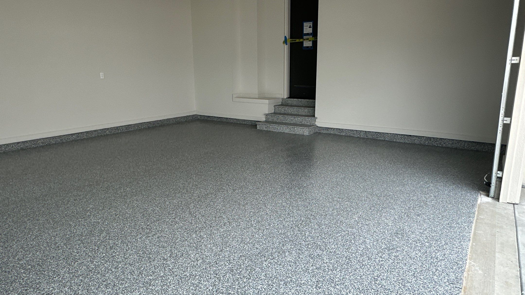 Check out how beautiful a brand new stonehenge flake floor looks by Banner Garage