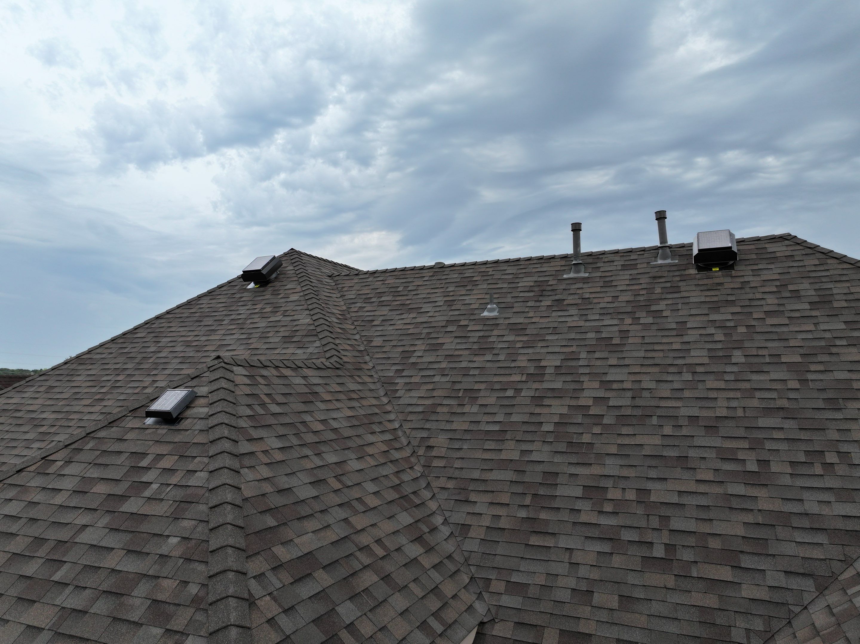 Installing Custom copper turret and Malarkey Vista Class 4 shingles Hail Damage Upgrade by Becker Roofing and Exteriors