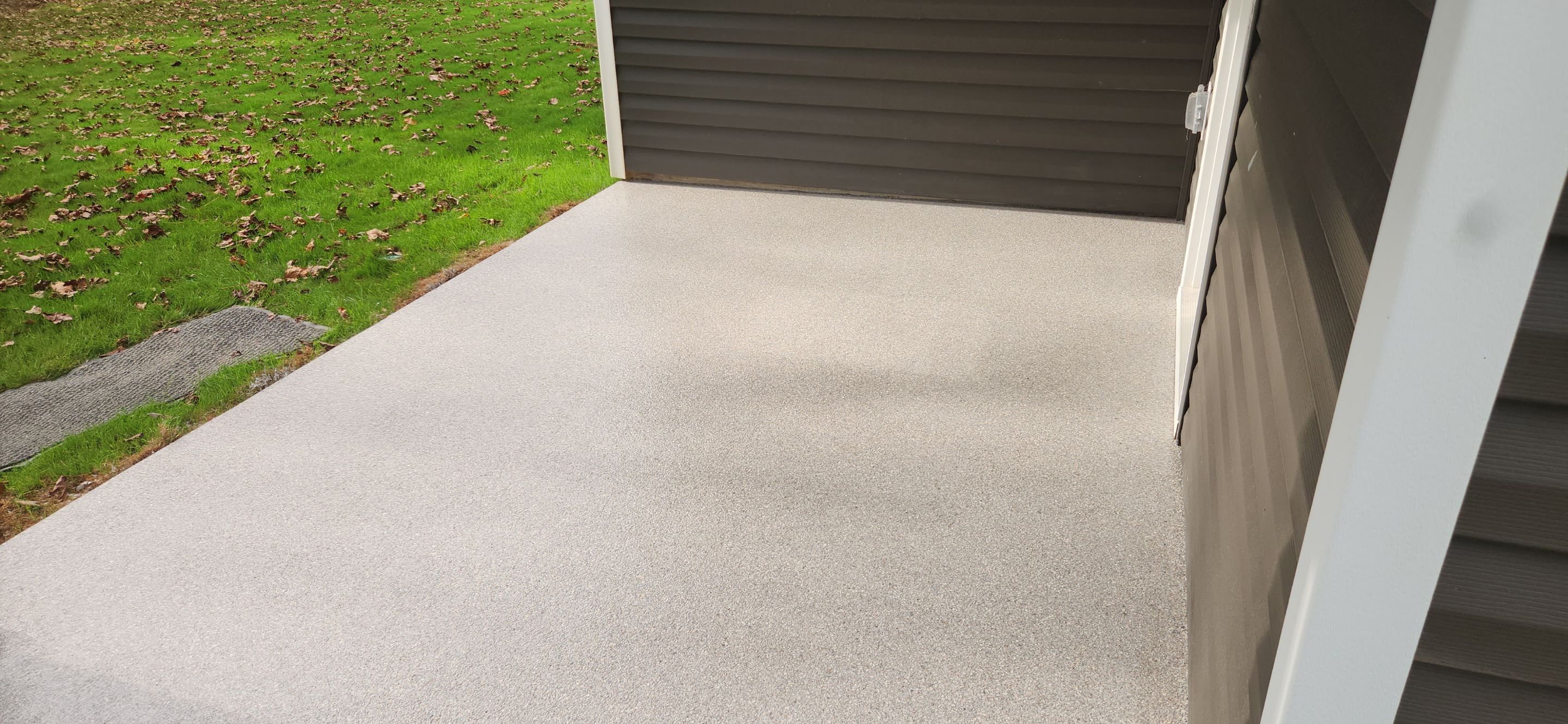 Garage & Back Patio using Domino & Pumice by Elite Floor Solutions