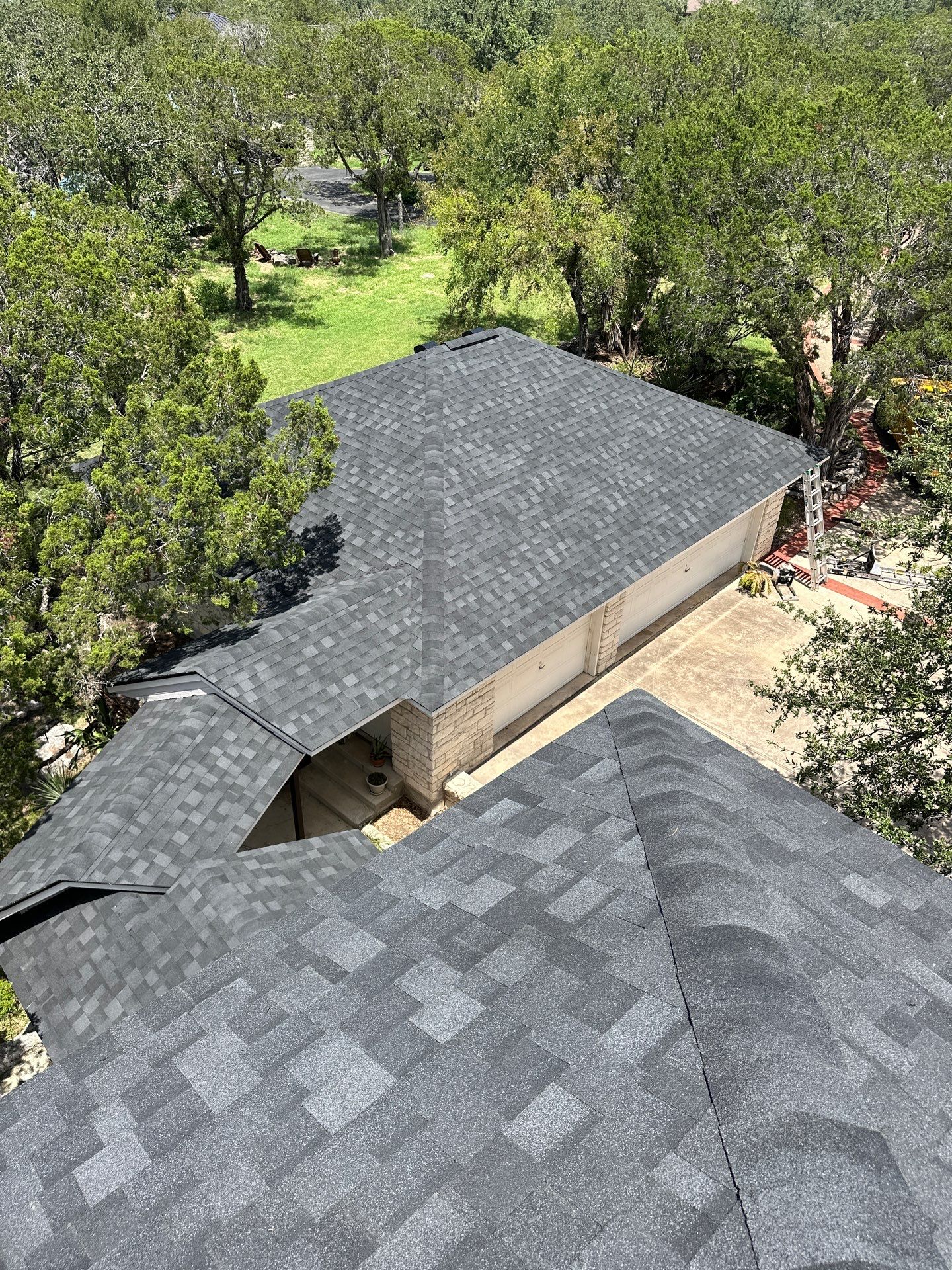 Residential Roofing Installation using IKO Nordic Granite Black by DeZign Roofing & Exteriors