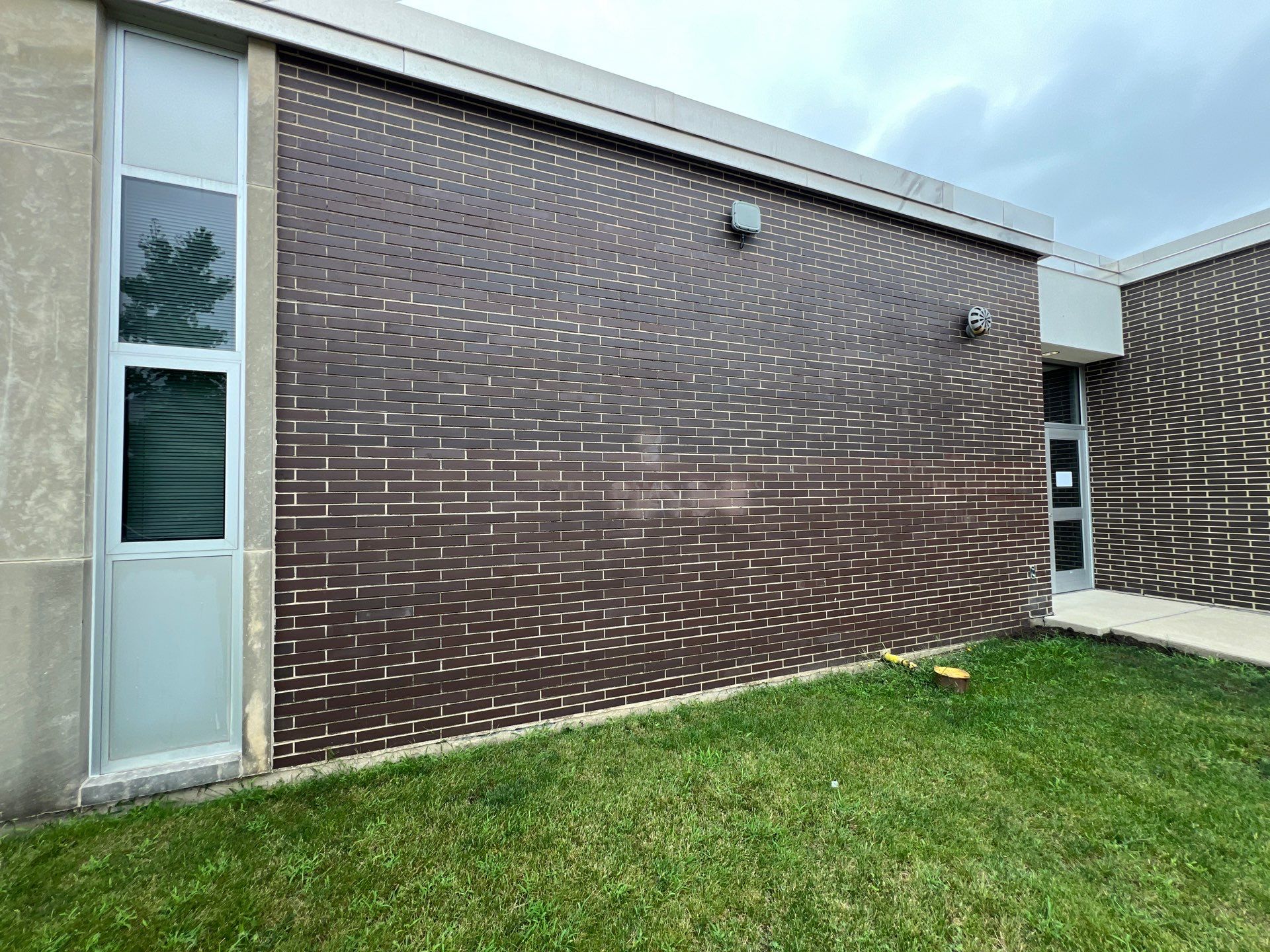 commercial pressure washing using Algaecide, soft wash soap by Northern Power Washing LLC.