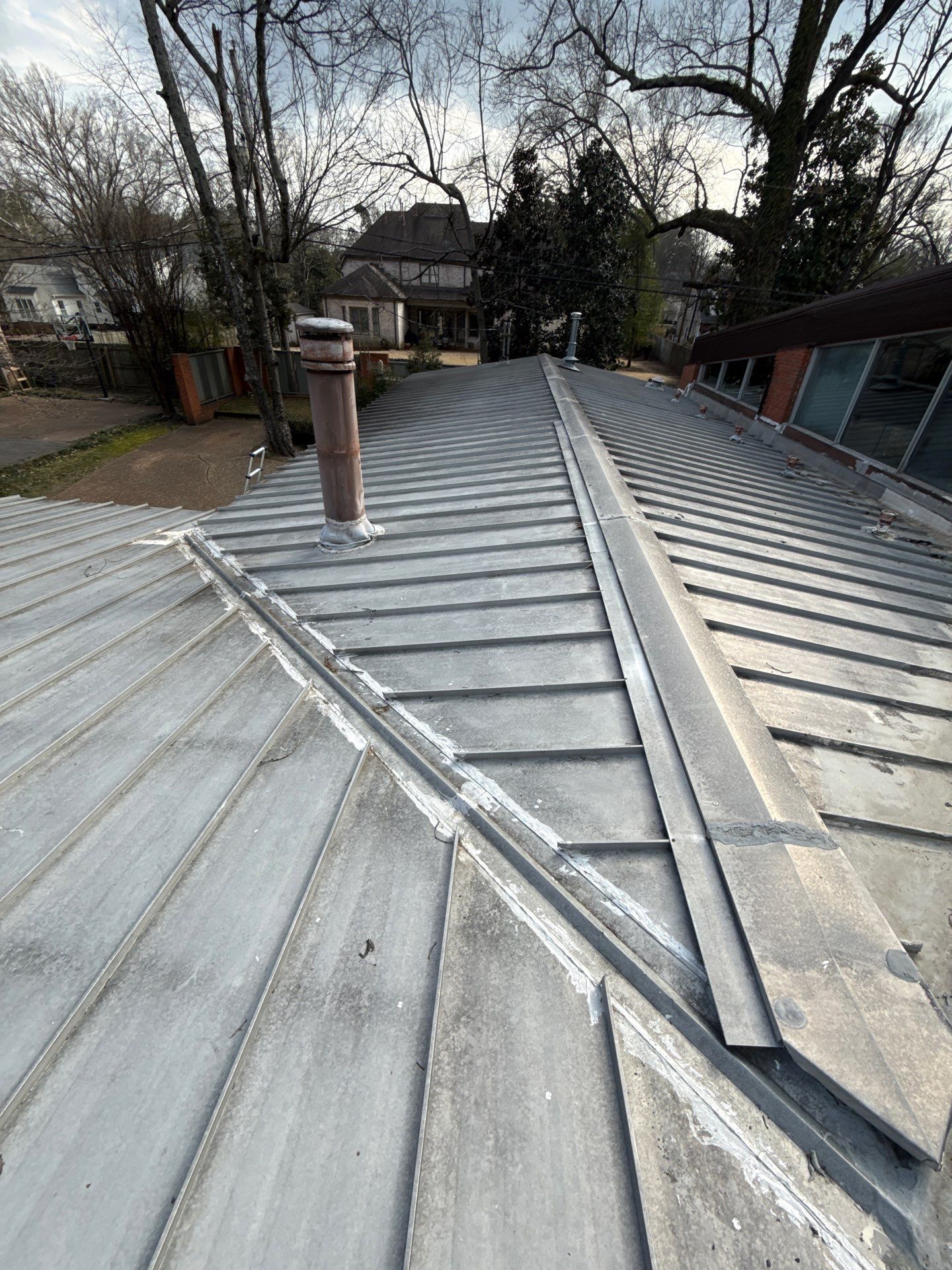 Residential Standing Seam Metal Roof and Membrane Replacement in Memphis by Revival Roofing Services