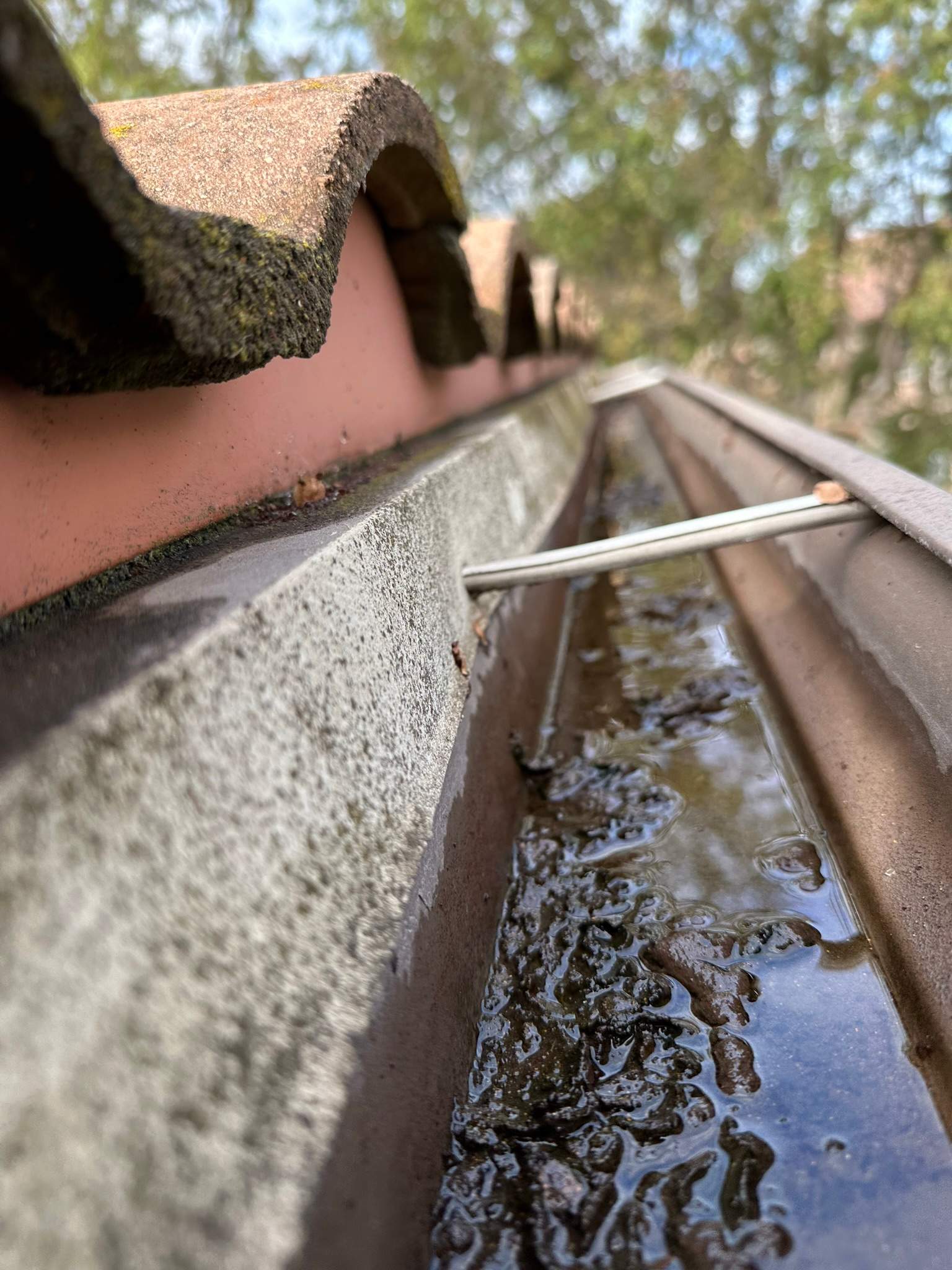 Clogged gutters at this Irvine home in Woodbury by Property Cleaning Experts, LLC