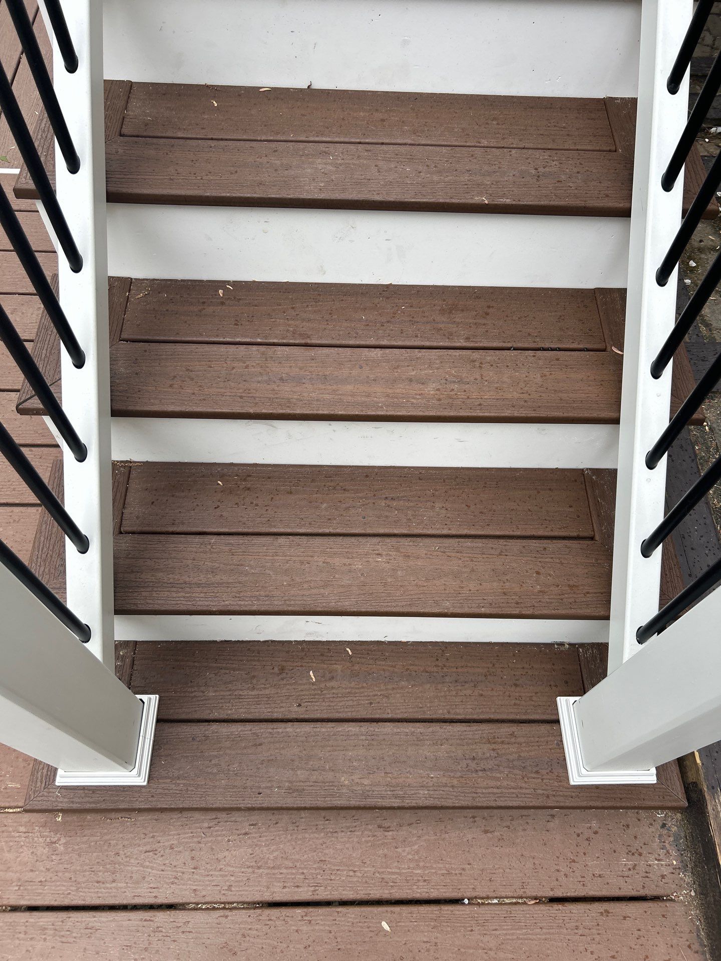 Elevated Composite Deck Replacement with White Railing in Tannersville by Herts Roofing & Construction