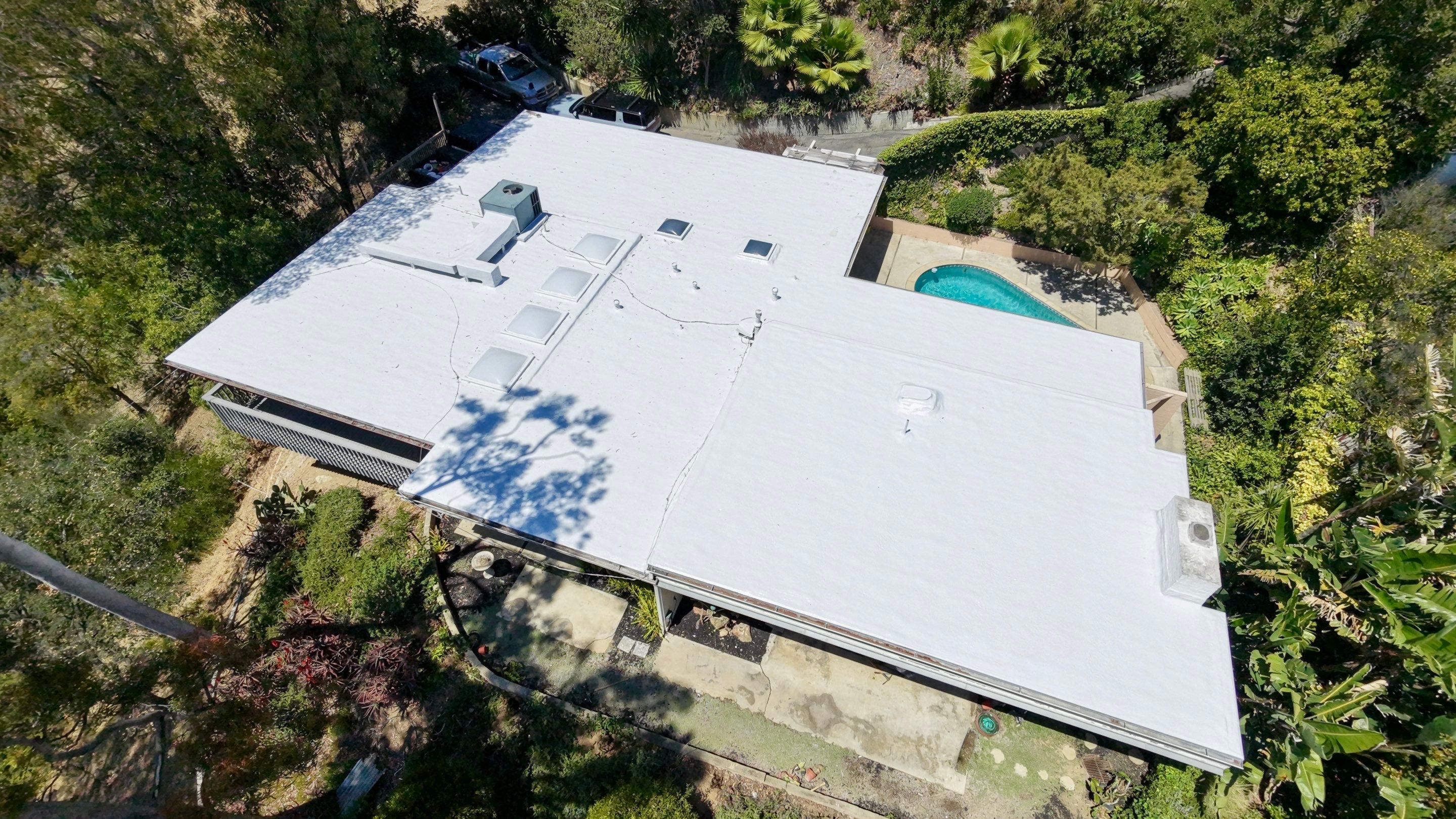 Residential Flat Roof Restoration with Silicone Coating in Brentwood by Hull Brothers Roofing