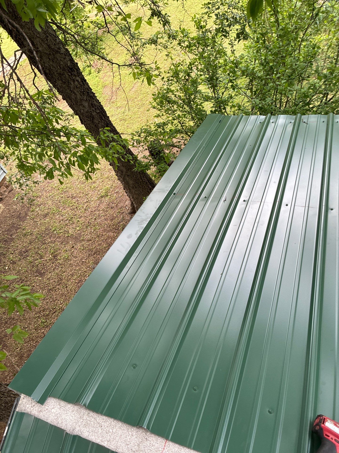 Metal roof installation by In & Out Construction & Remodeling, LLC