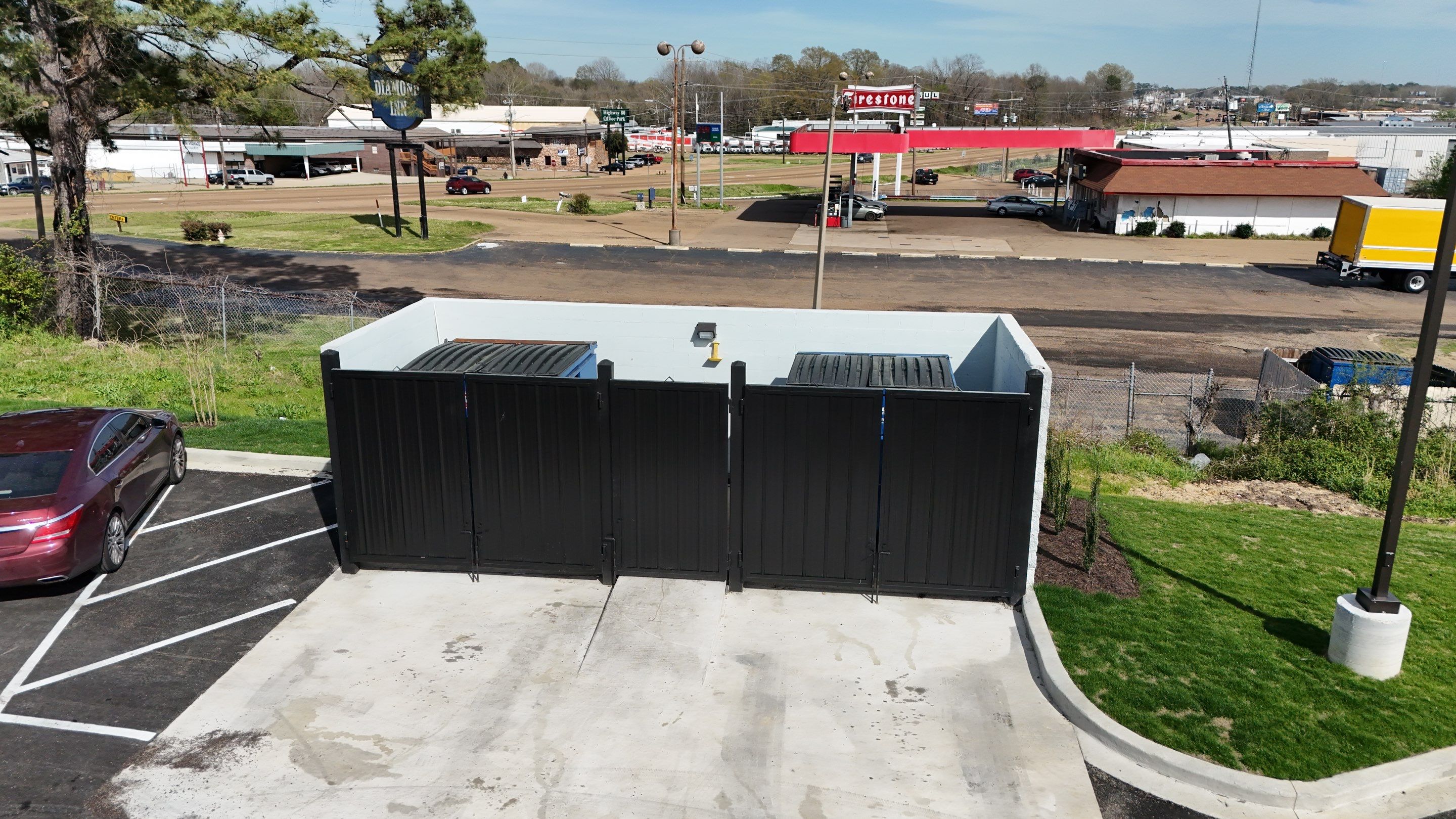 6' Black Chain Link Fence & Concrete Block Dumpster Enclosure by Roberson Construction LLC