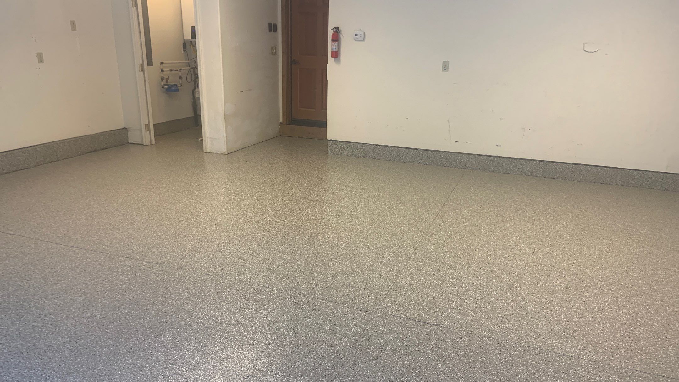 Garage Transformation using Pebble Beach by Croc Coatings, LLC