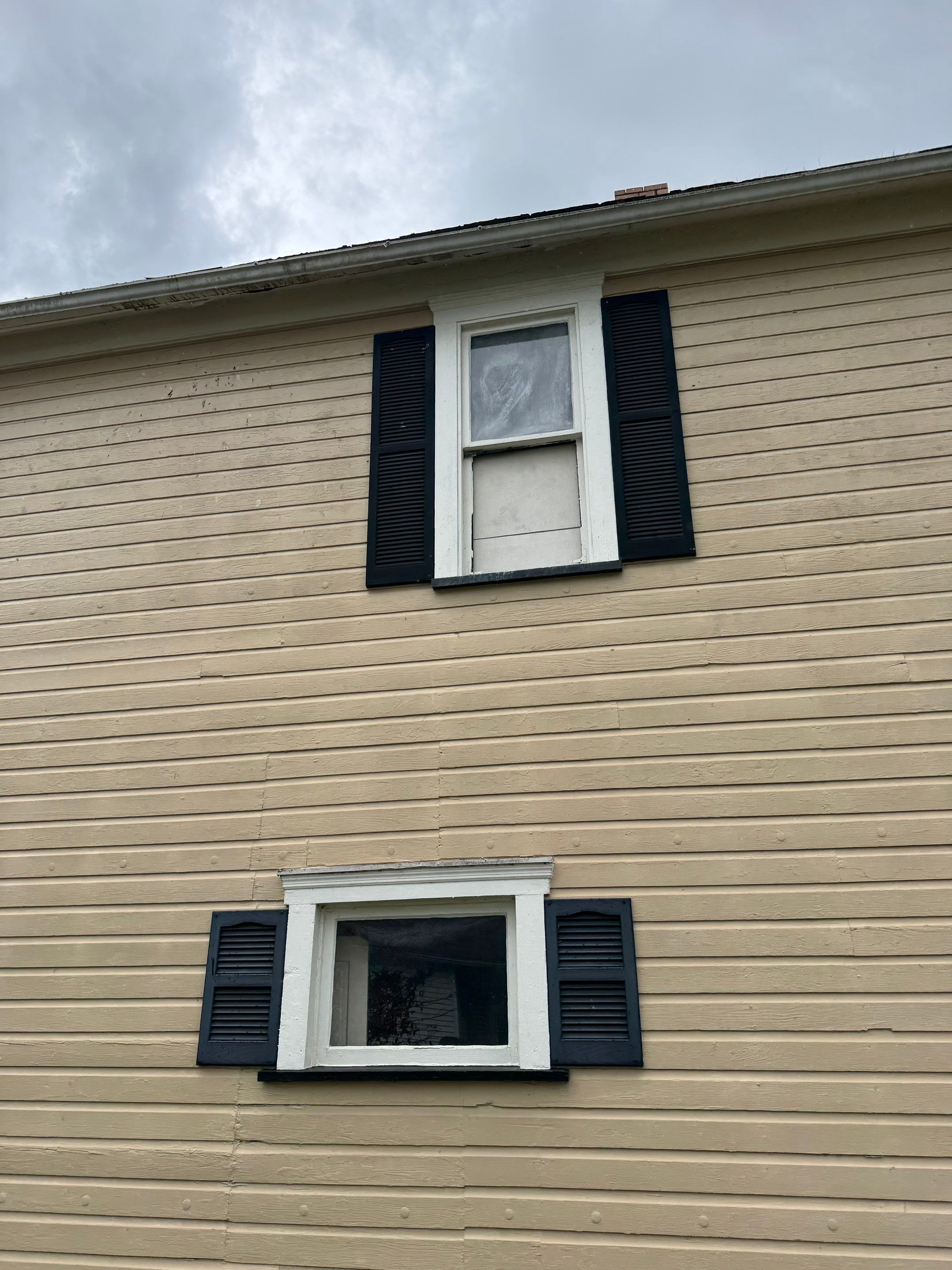 Vinyl Window Replacement and Black Shutter Installation in Dennison by Ohio State Windows