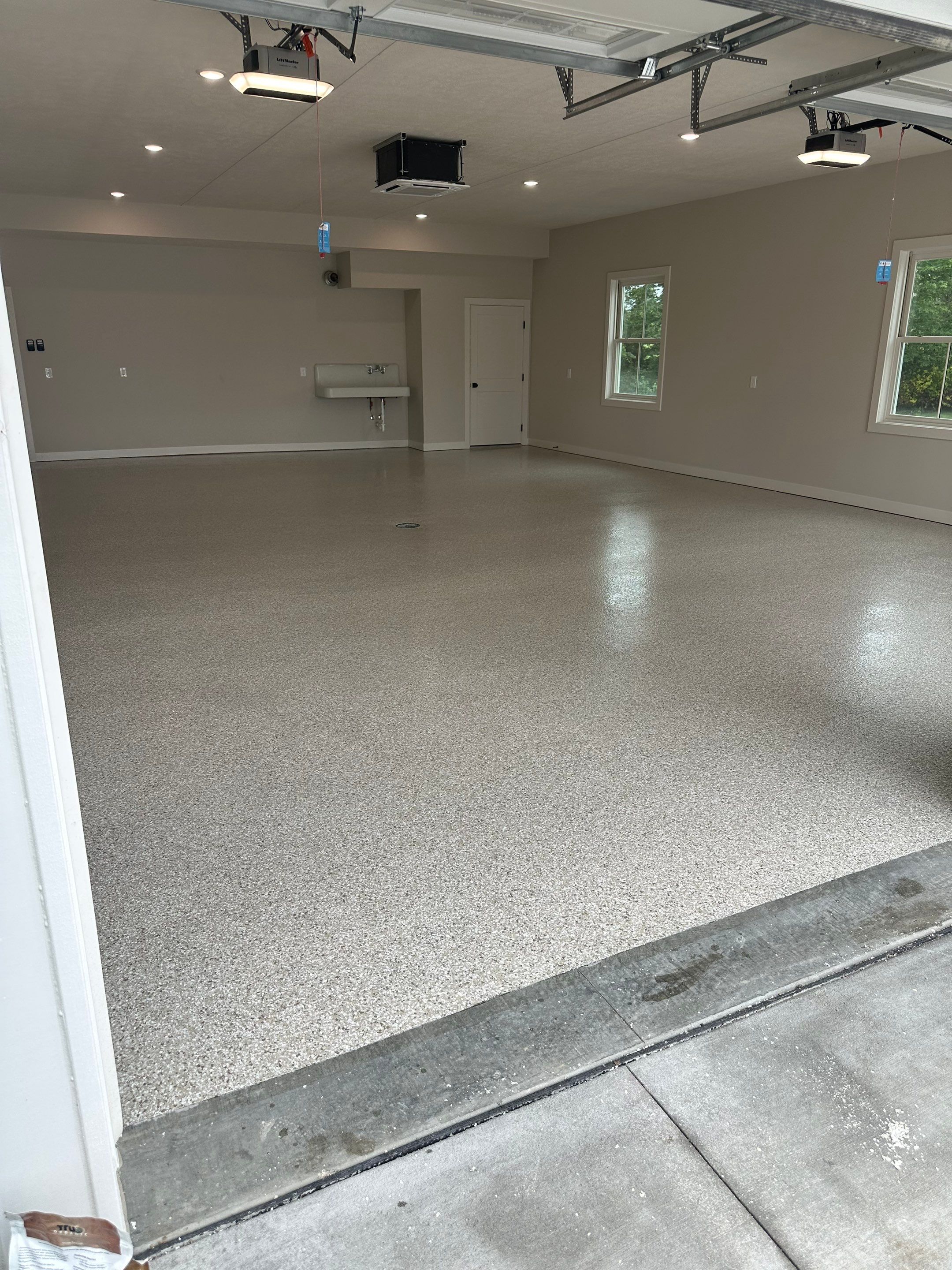 Trail Mix Epoxy Garage / Even Space by Goat Coatings