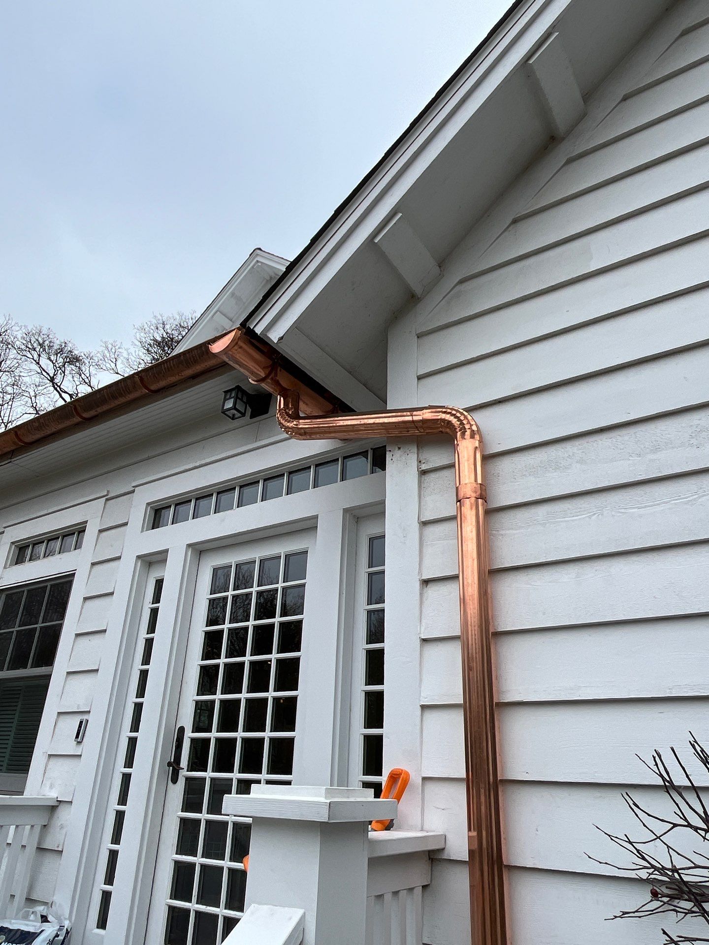Asphalt Roof Replacement with Half Round Copper Gutter Installment by Custom Installations, Inc.