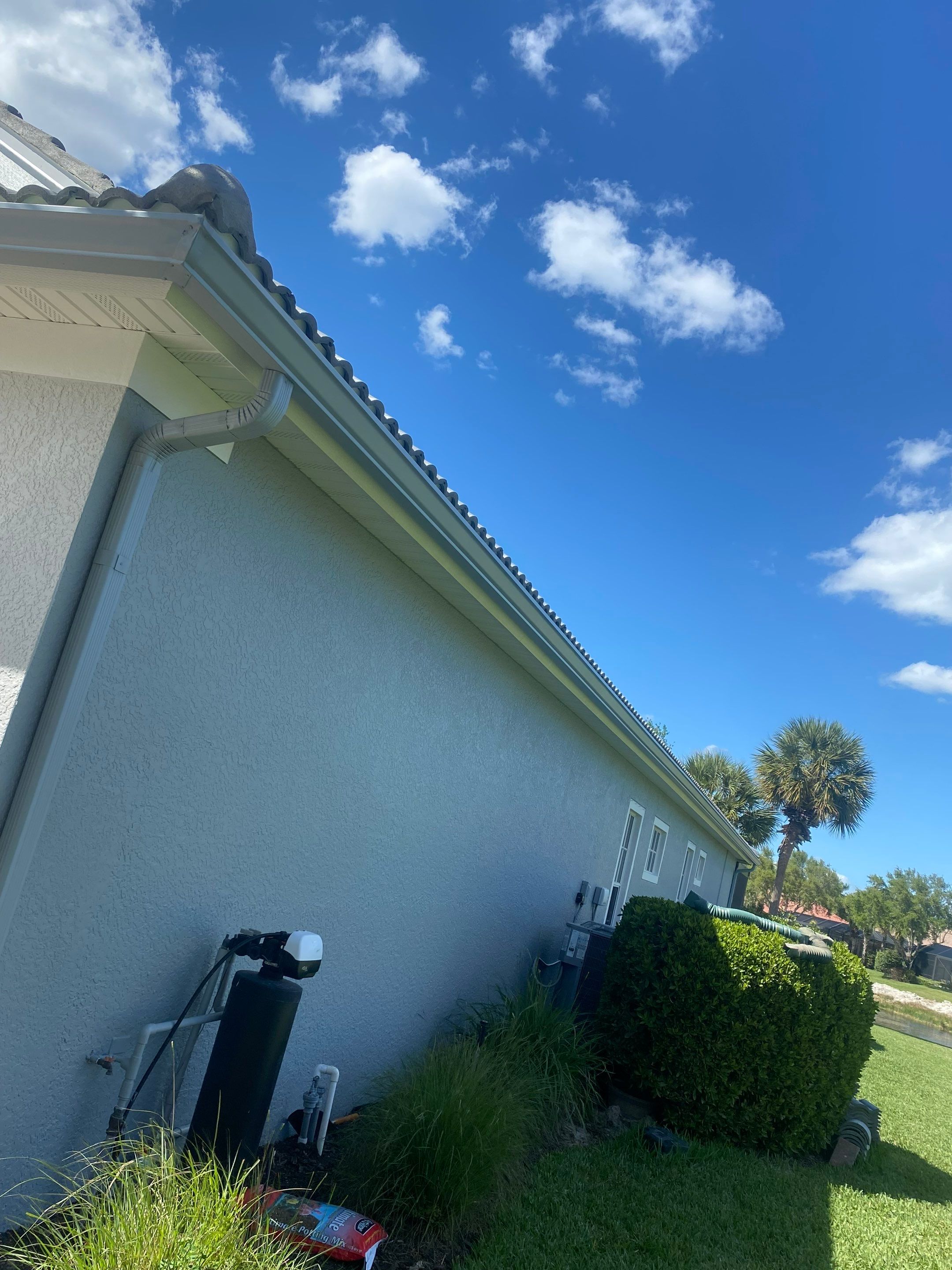 6-inch K-style Seamless Gutters and Splash Guard in Grey Color in Naples FL by Gutter Professors
