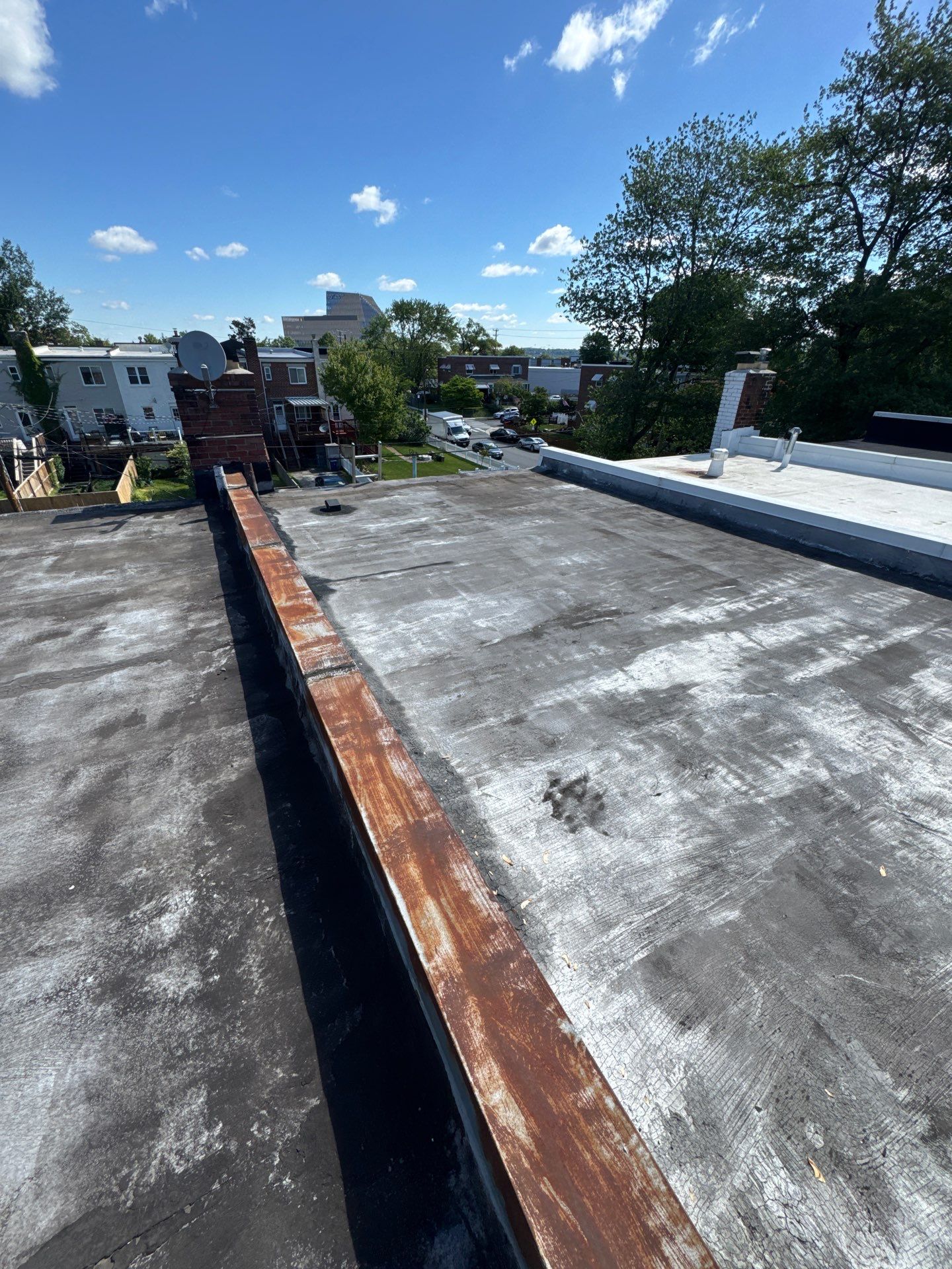 Alexandria Rowhouse TPO Flat Roof Replacement by Ridge Armor Renovations