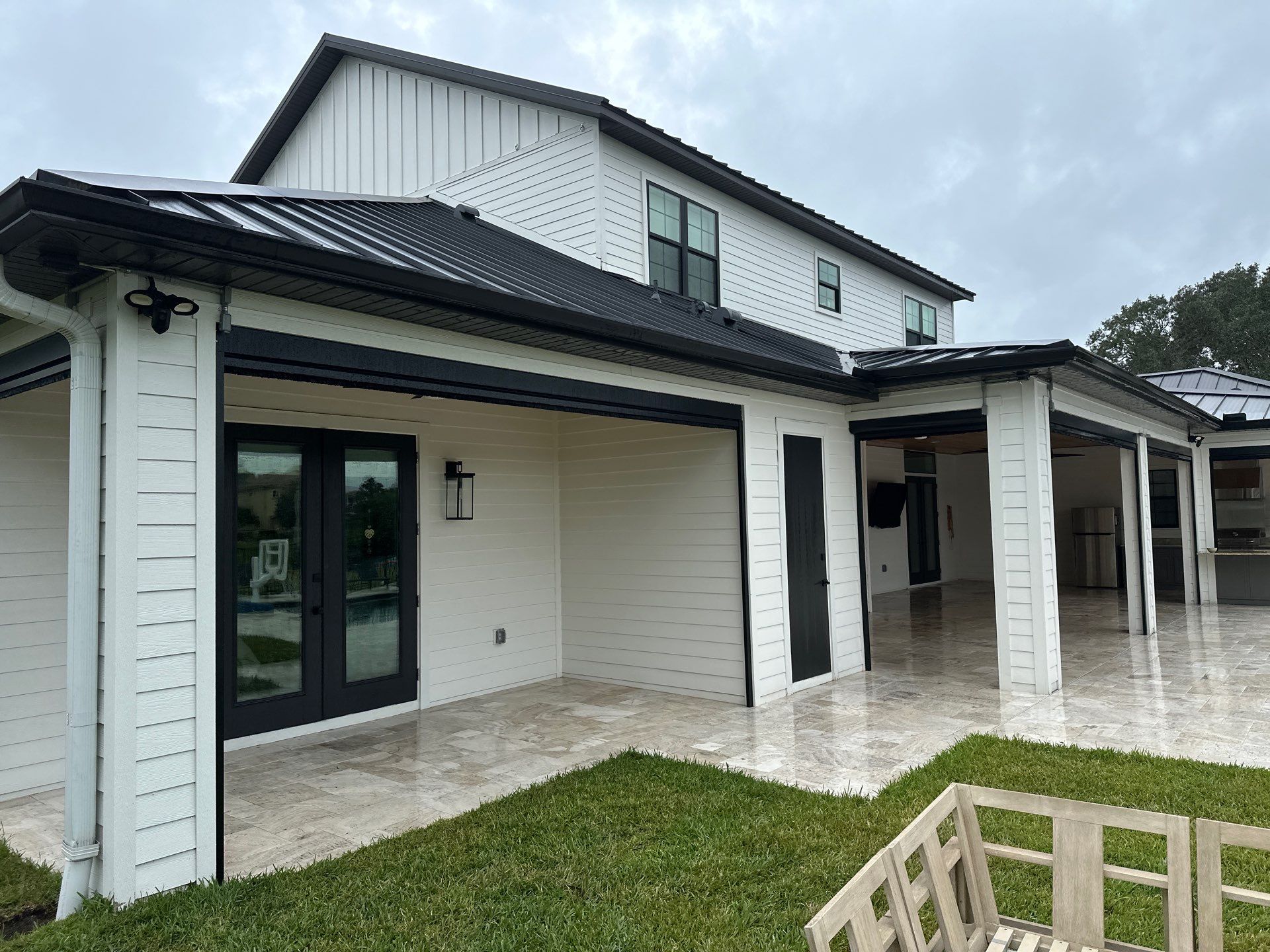 Complete Two-Story House Wash and Driveway Cleaning in Winding River Community, Bradenton, FL by Sunshine AquaWash