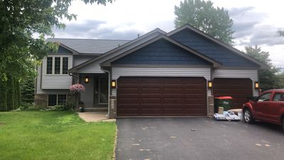 Storm Damage Restoration using Atlas Pinnacle Shingles and Mastic Vinyl Siding 