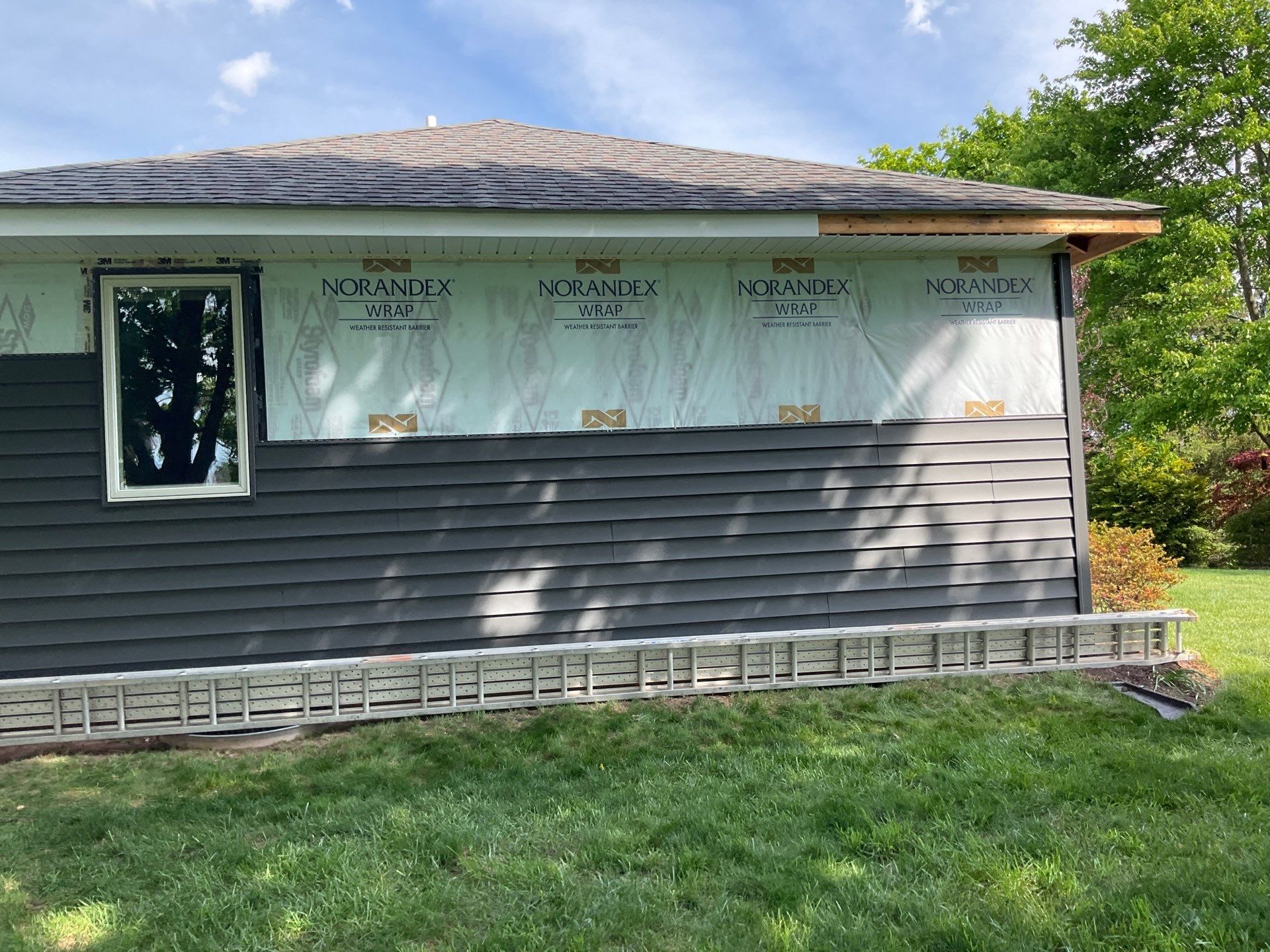Nightfall Exterior Siding Replacement and Stone Veneer in Halifax by Esh Builders