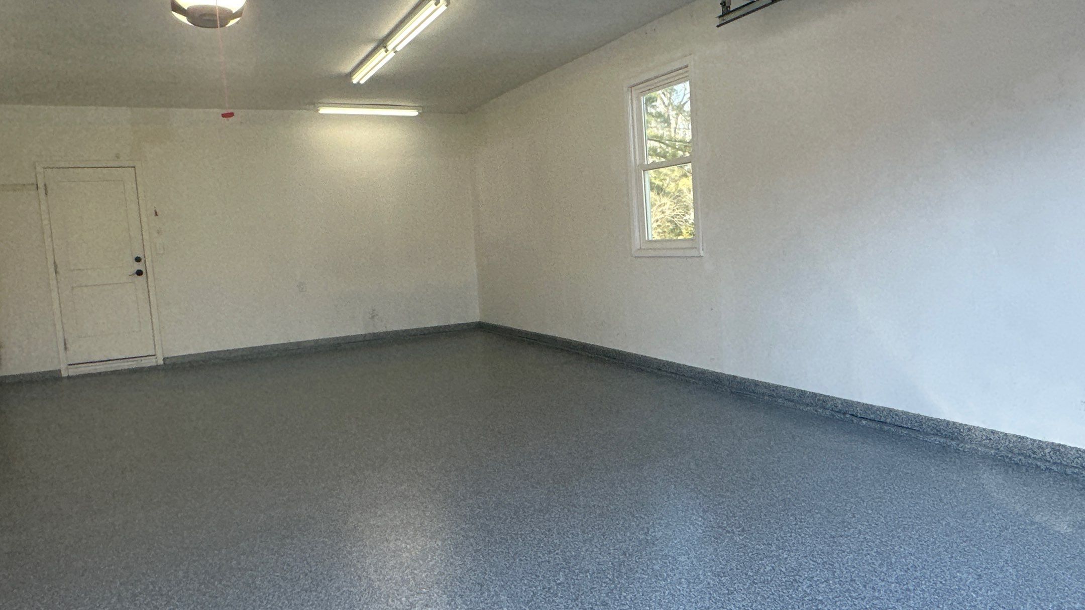 Check Out Anne's New Polar Floor by Banner Garage