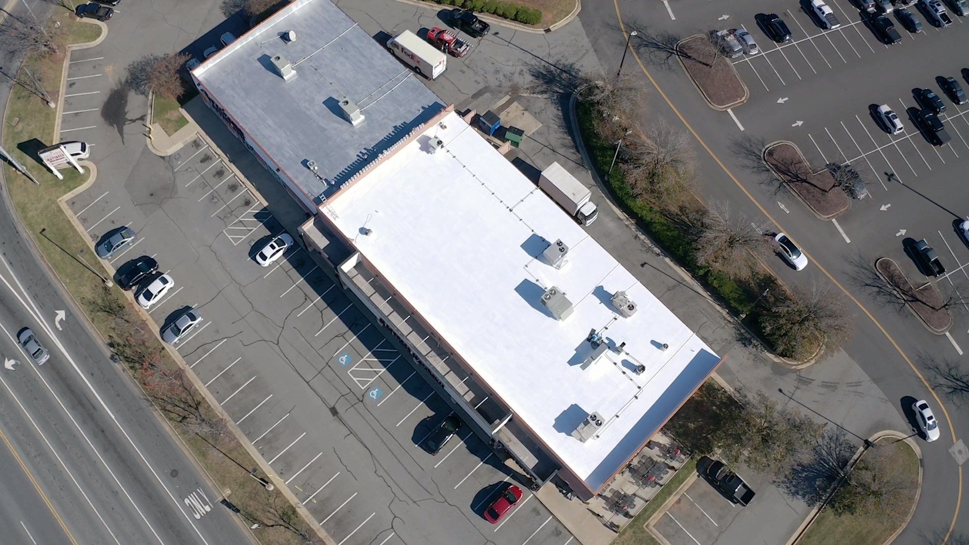 Commercial Coating using Poly Urerthane and Silicone Coating by Just In Time Roofing and Restoration