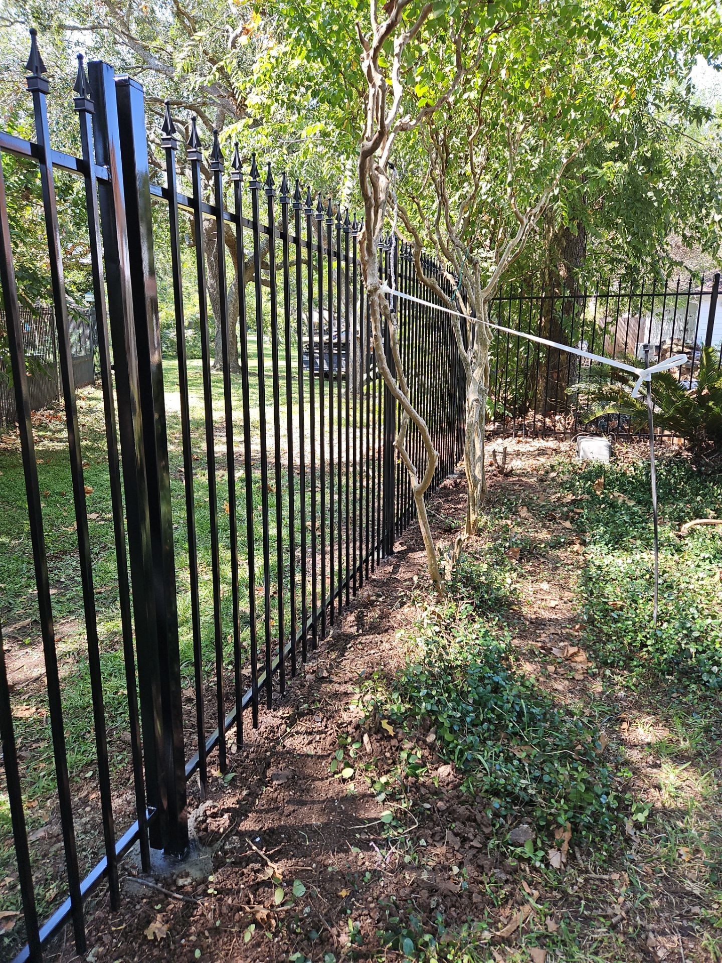 Iron fence installation using LION iron panel - 2 Rail, 6ft Tall by Tim's Fences
