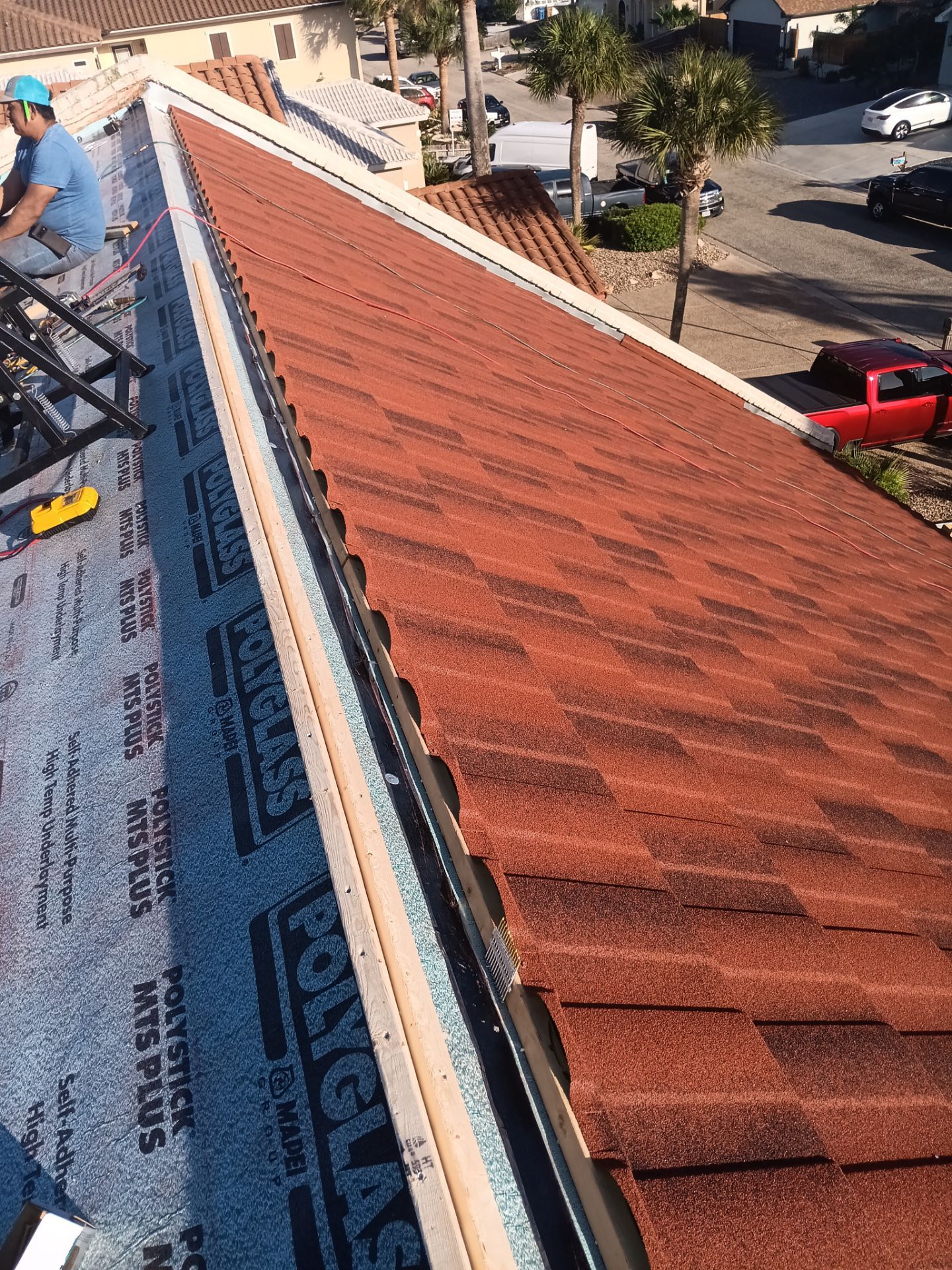 Off with the Tile and on with the TILCOR stone coated metal.  by Bayfront Roofing and Construction