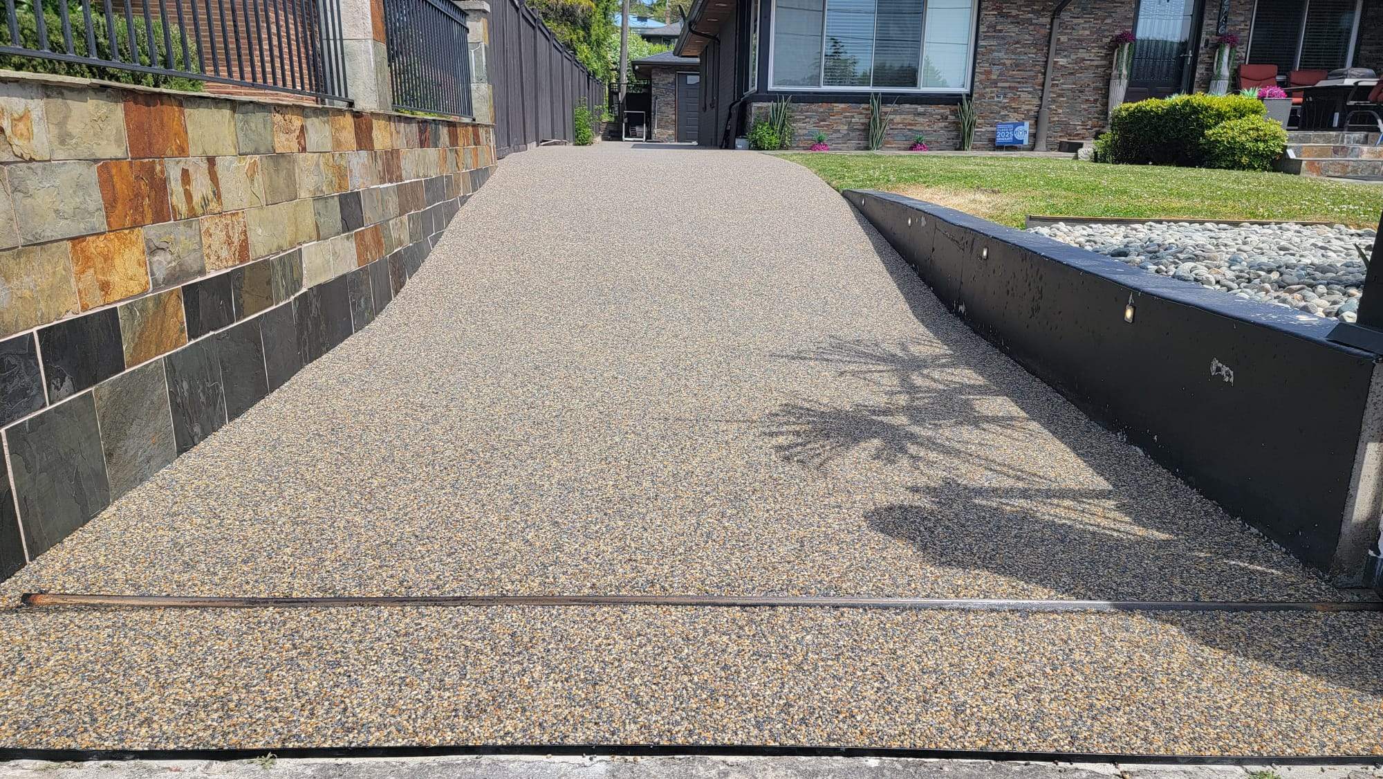 The Versailles Vuba Elegance Driveway by Concrete Coating Experts Inc.