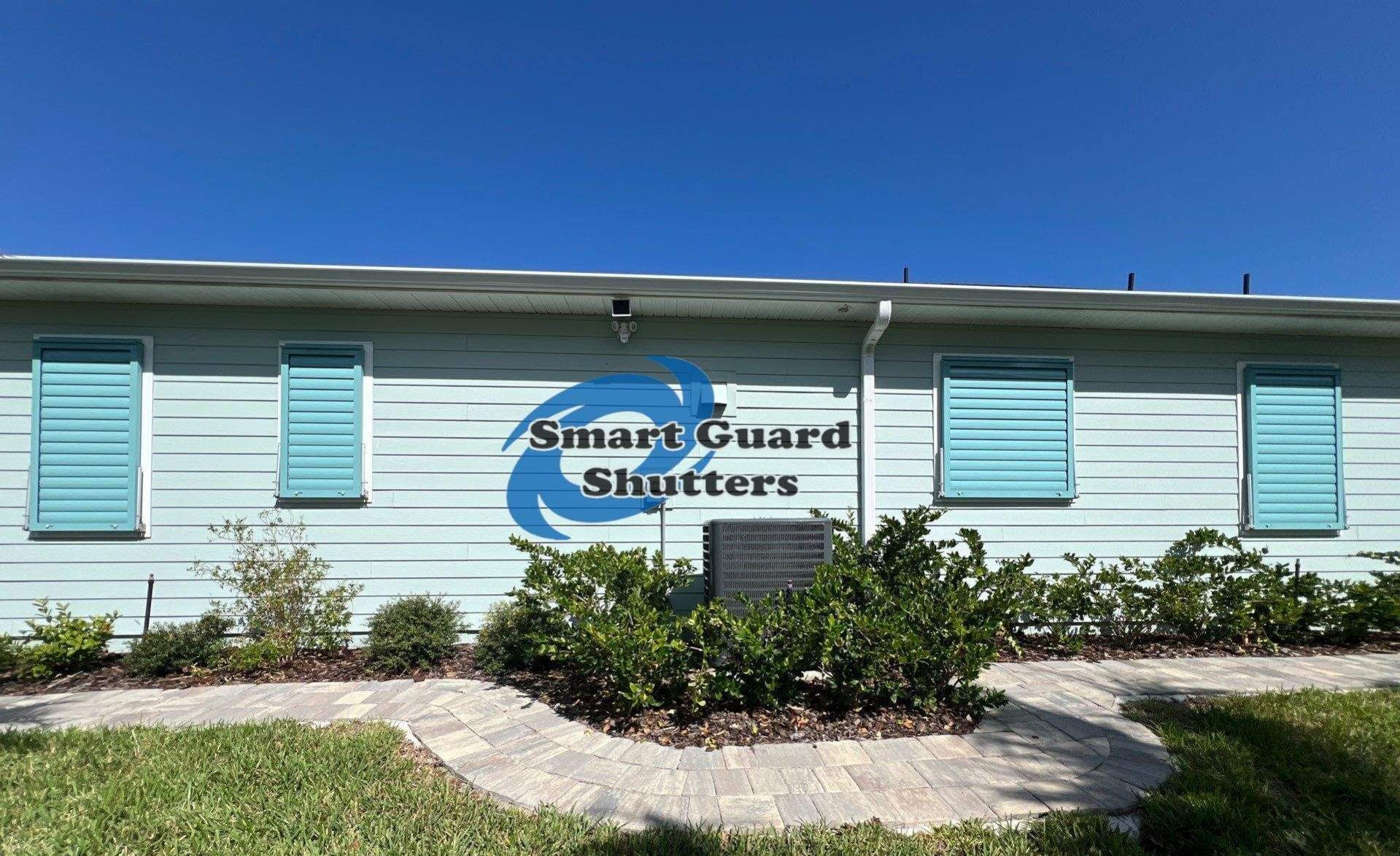 Impact Bahama Shutters in Pastel Turquoise by Smart Guard Shutters