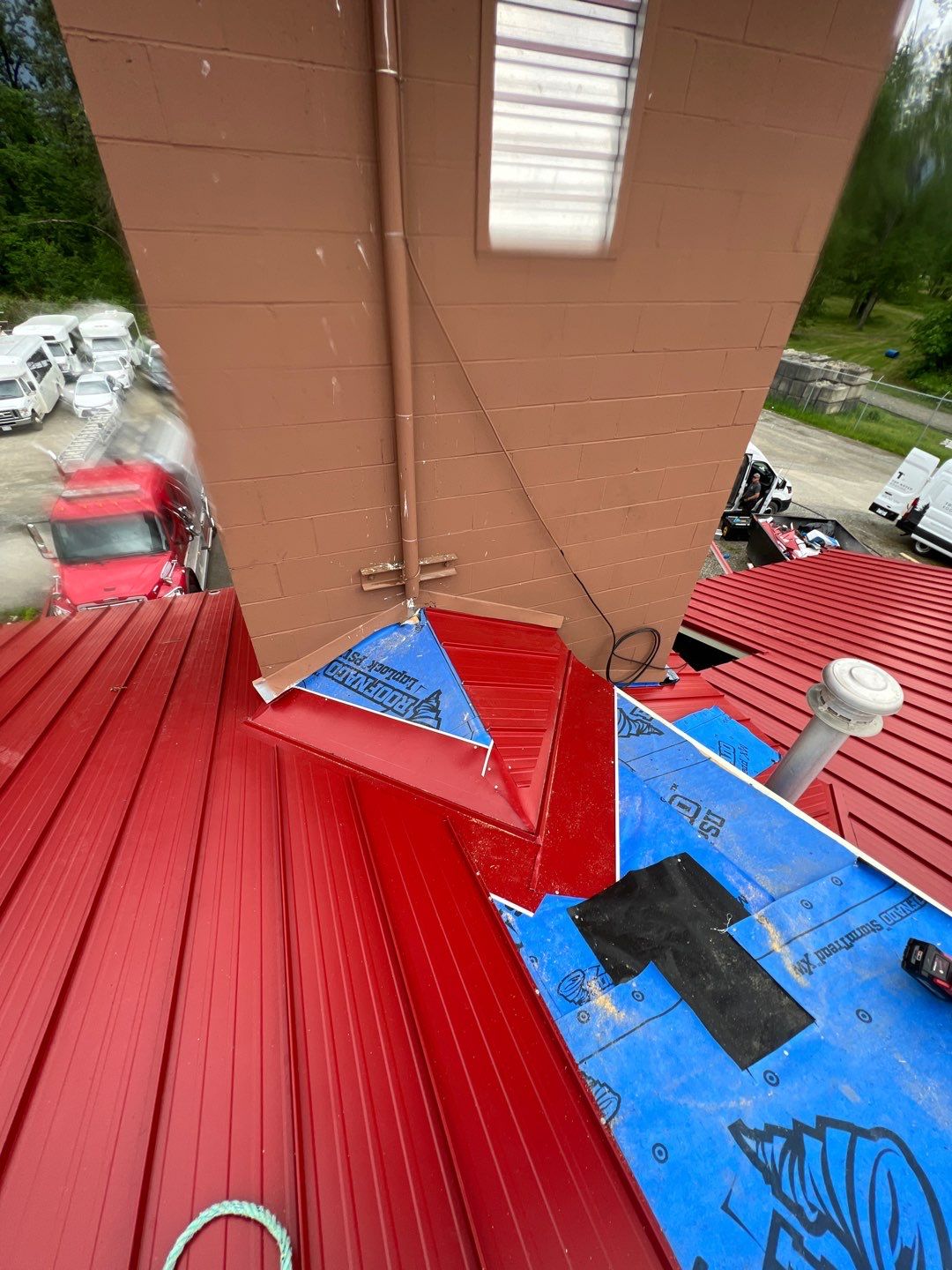 Commercial Roofing Installation using 12" Prolok metal  by Top Notch Roofing Inc