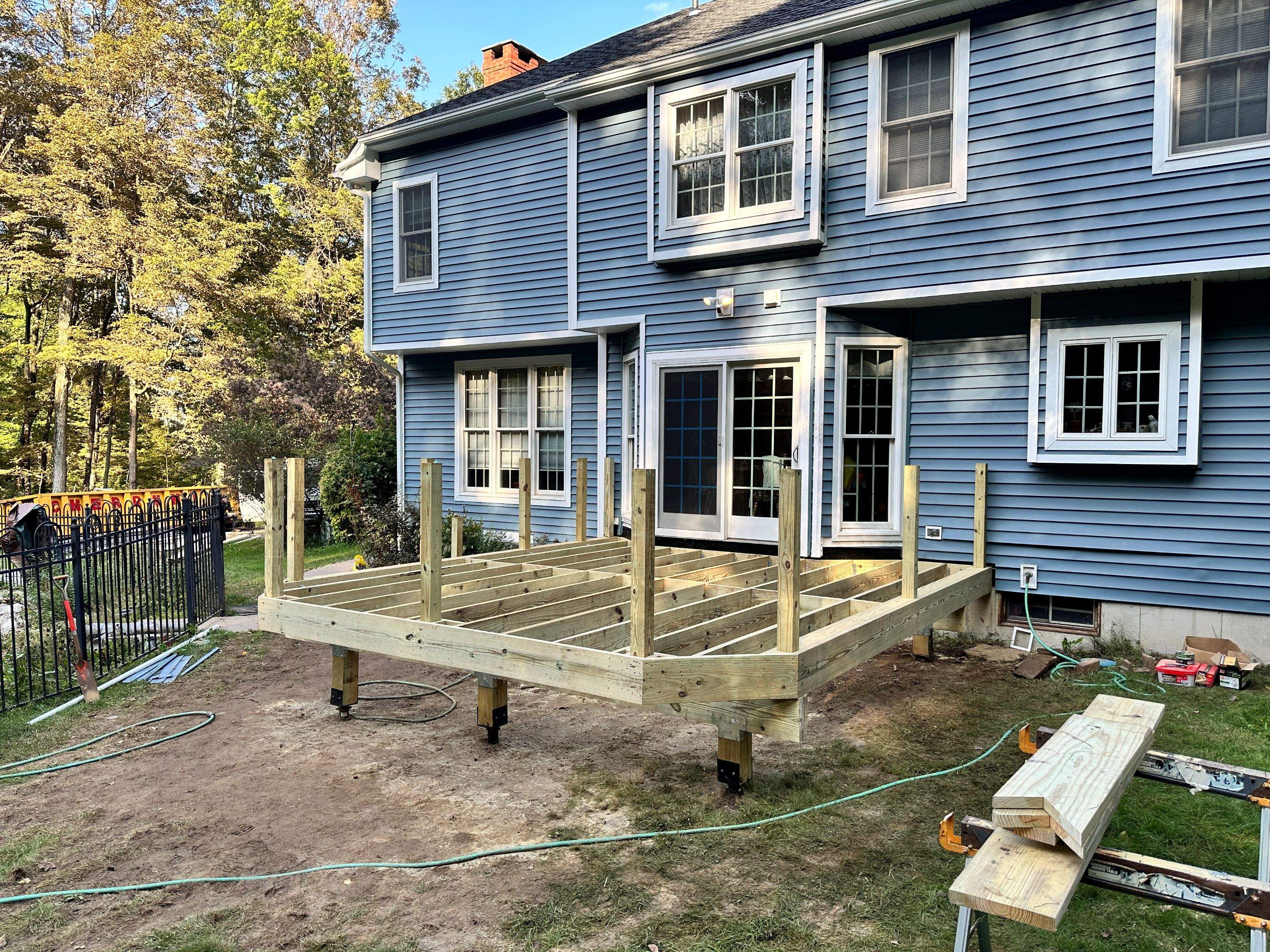 Deck replacement using Trex lineage Rainier with angled edges, Transcend cocktail rail and lattice. by DiGiorgi Roofing and Siding Inc