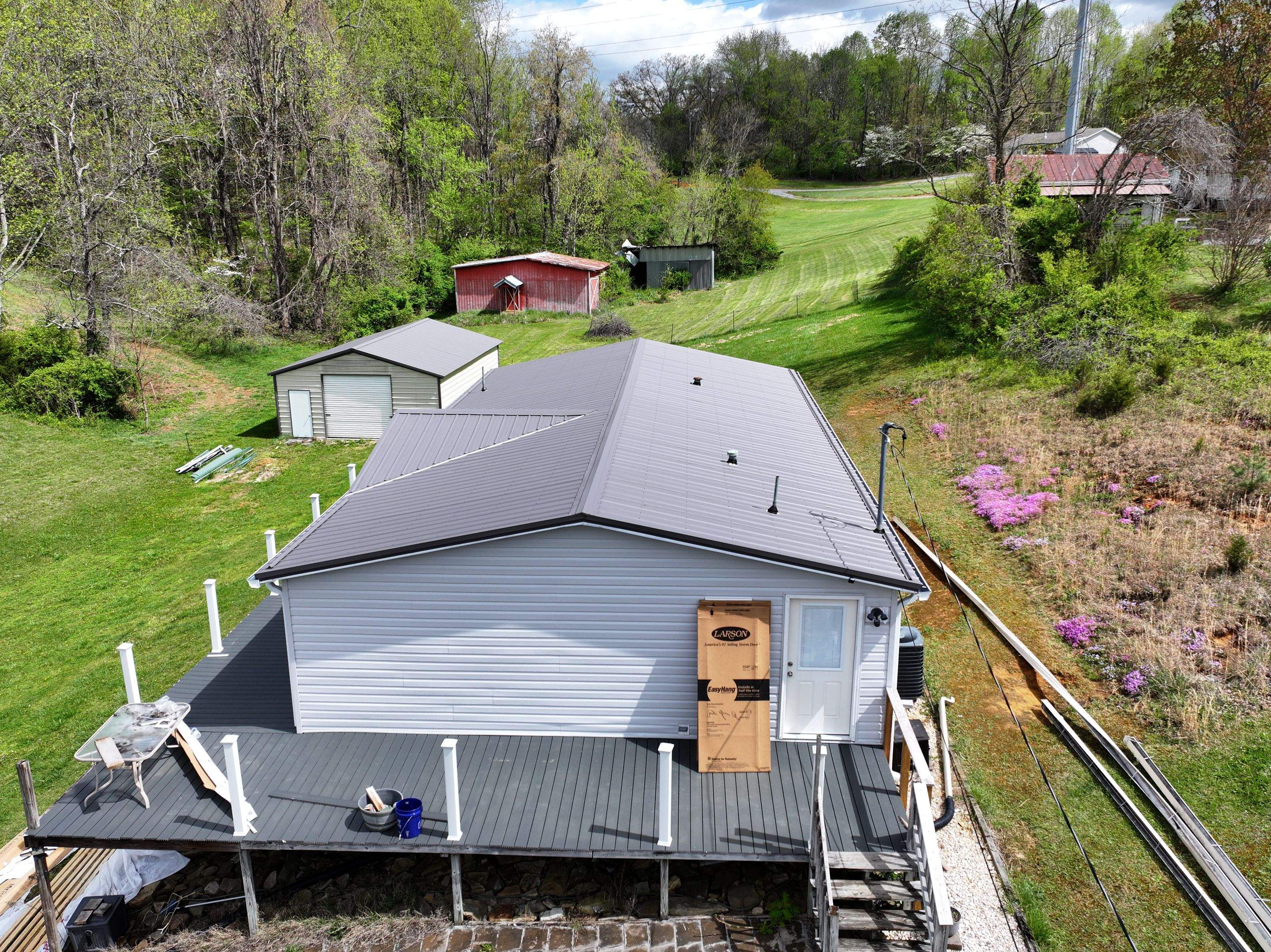Charcoal Gray Textured Metal Roof by Omnia Roofing